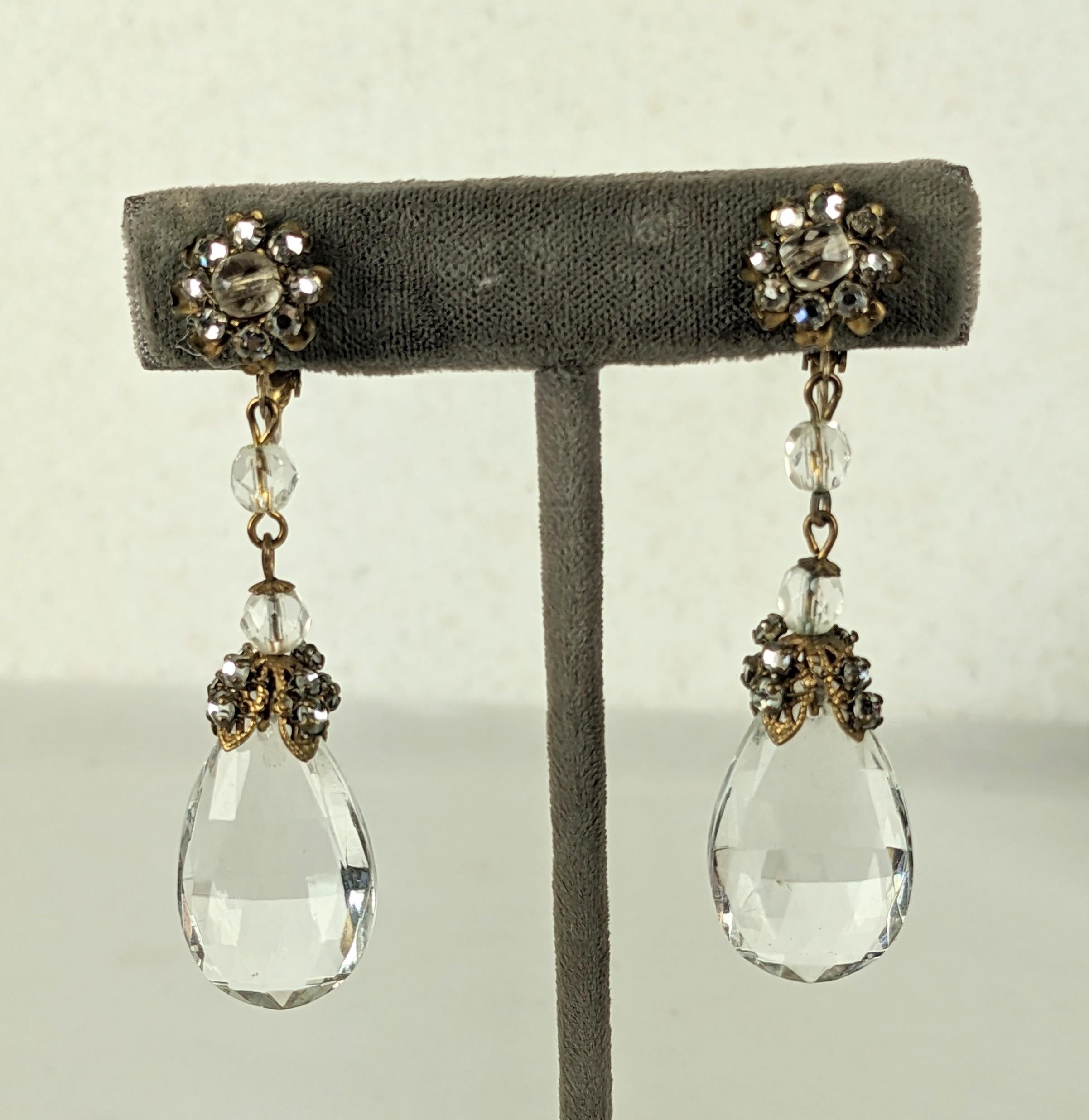 Miriam Haskell Crystal and Pave Drop Earrings from the 1950's. Antique crystal drops are set with signature filigrees with woven crystal rose montee accents. Clip back fittings.
Signed. 2.5