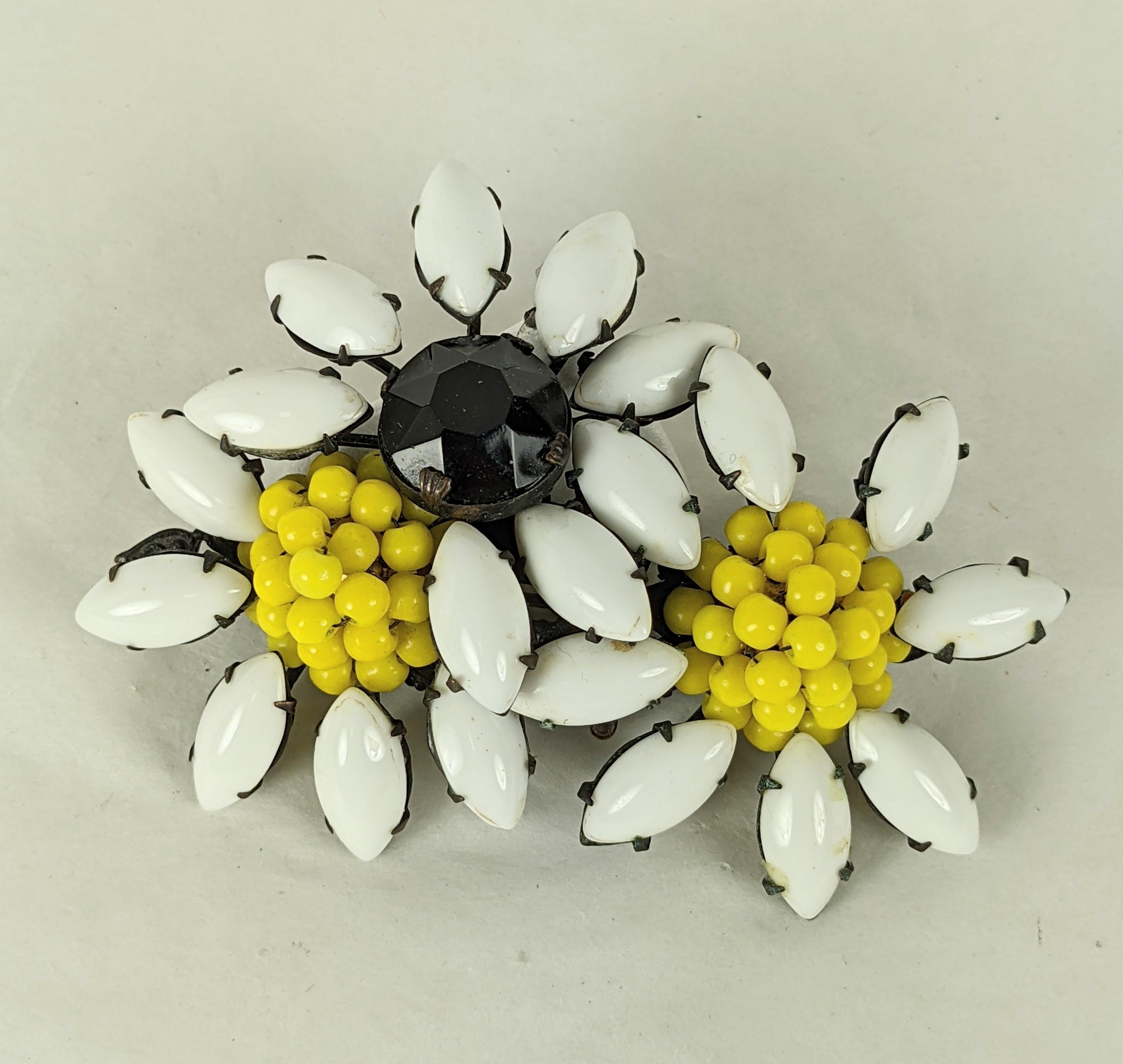Miriam Haskell Daisy Cluster Brooch of milk glass navettes with embroidered chrome yellow bead centers and jet crystal, set in blackened metal. Signed, 1950's USA.
3.25