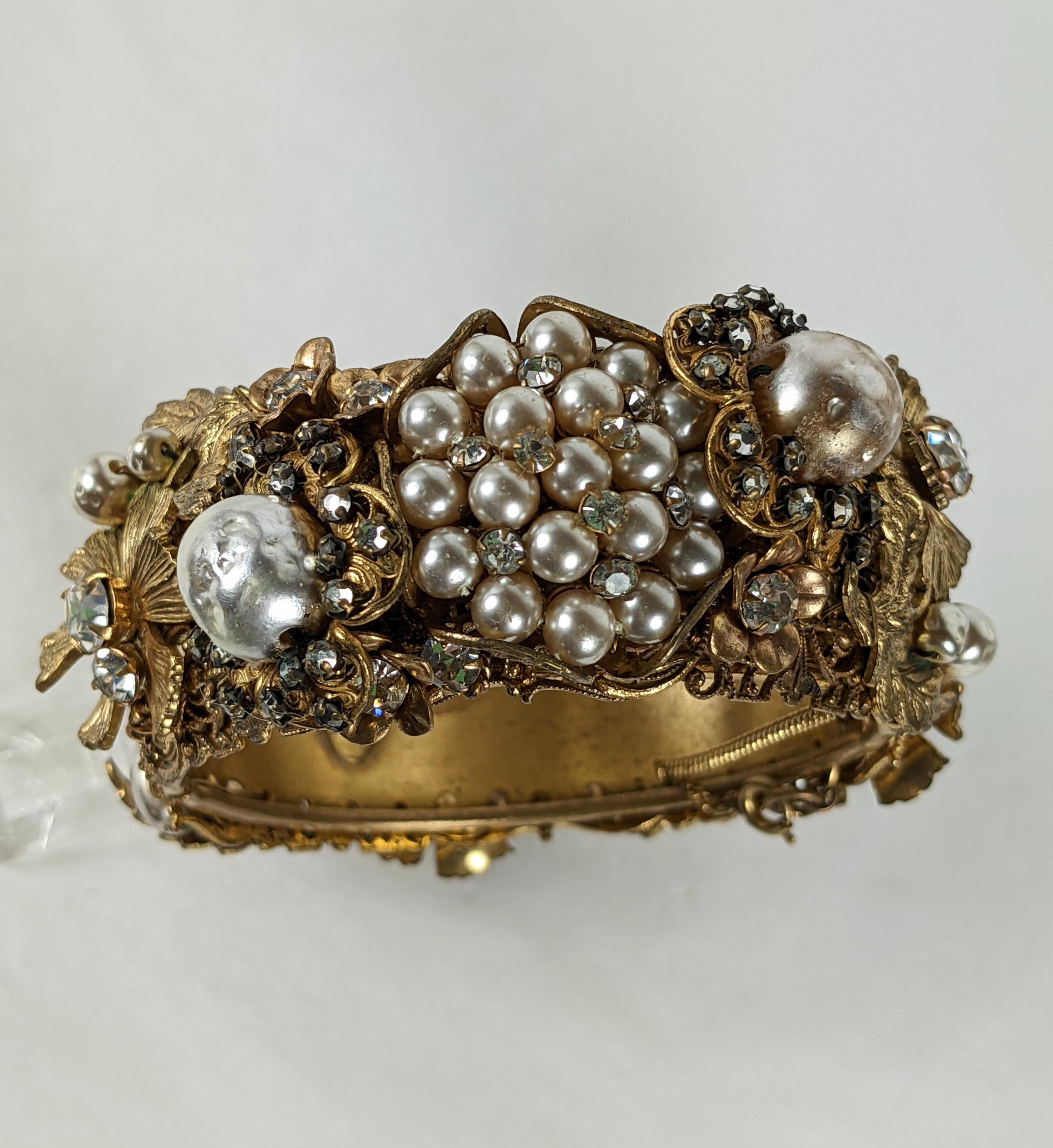 Amazing collector quality Miriam Haskell elaborate etched and incised hinged cuff bracelet of signature Russian gilt plating with large and small baroque pearl flower heads, prong set large and small crystal rhinestones.  All hand sewn or set on to