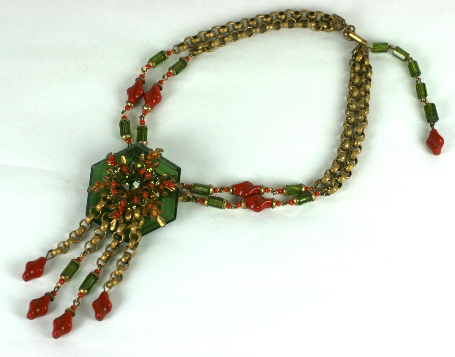 Lovely Miriam Haskell Faceted Crystal Beaded necklace from the 1940's. A large olive green hexagonal crystal is bolted onto a signature Haskell filigree base on the pendant. A dimensional growth of seaweed leaves emanate from the olive crystal