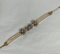 Tour de cou avec nœud en fausses perles et cristal Miriam Haskell