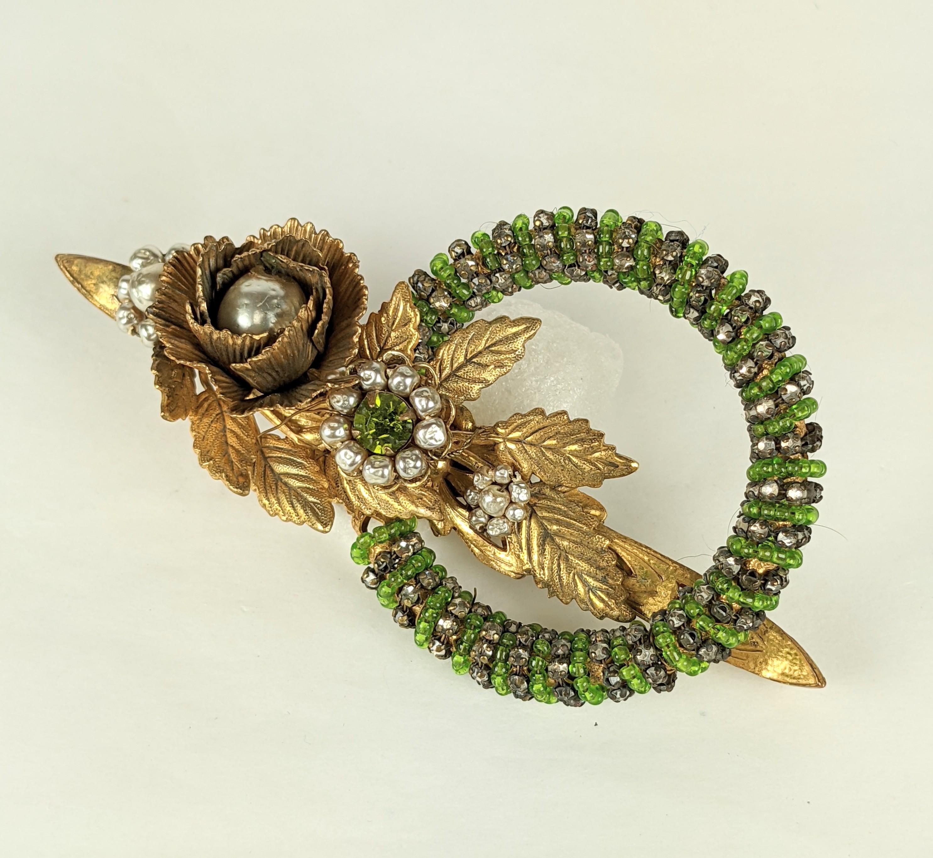 Miriam Haskell Gilt Flower Brooch with Beaded Hoop in pastes and pale emerald beads with faux pearls and Russian gilt finish, large and unusual.
1940's USA.  4