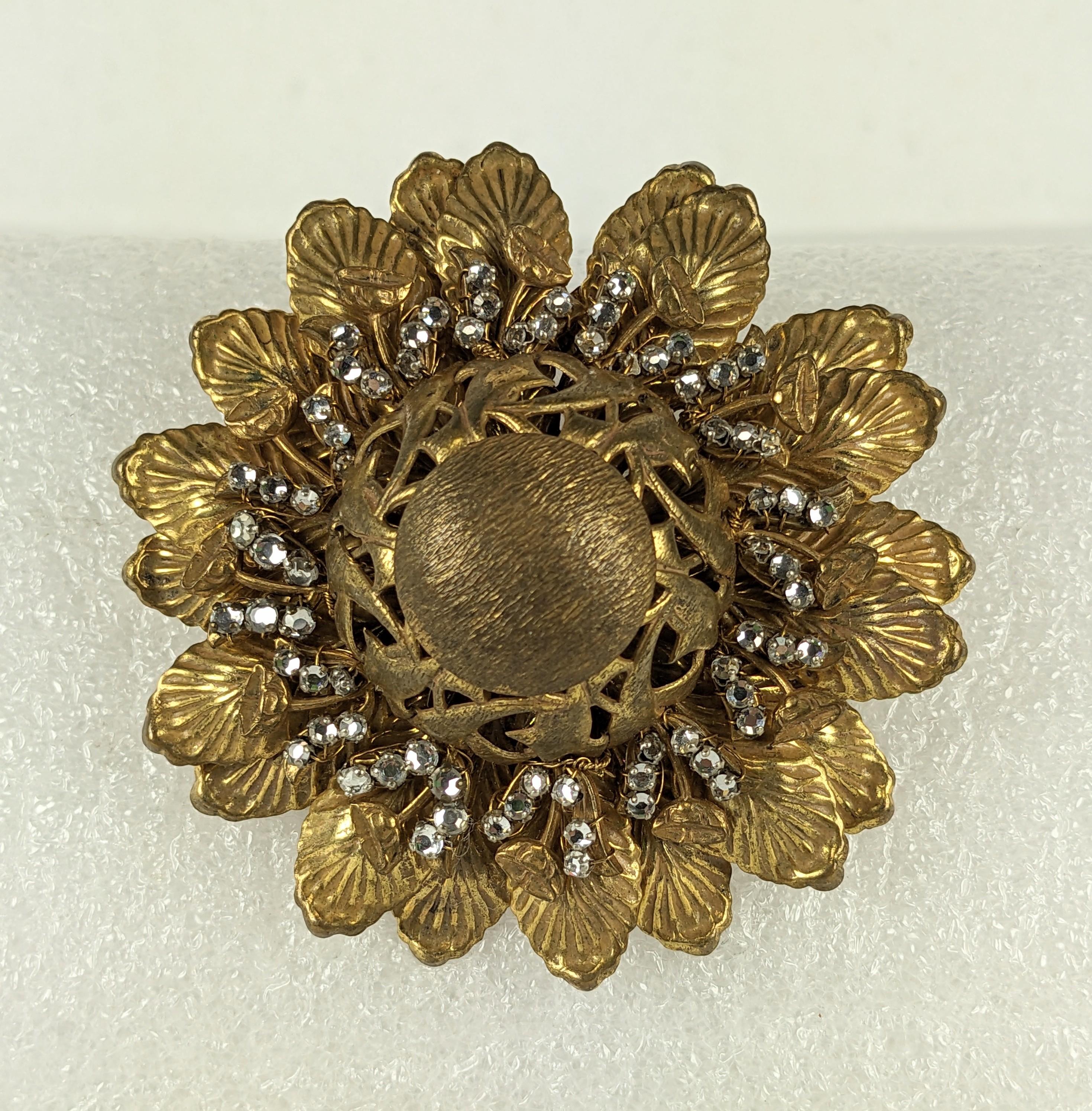 Large Miriam Haskell Gilt Flower with Rose Montees from the 1940's. Gilt leaves and buds are sewn onto a filigree base with sewn crystal accents. 1940's USA. Signed. 2.75