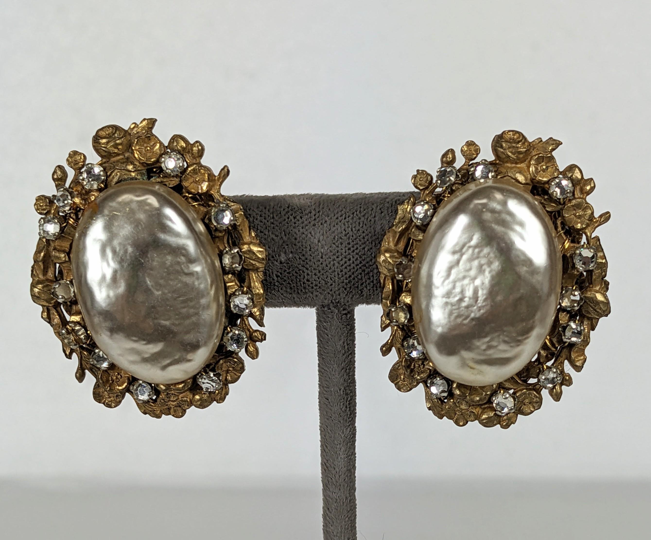 Dramatic Miriam Haskell Large Faux Pearl and Crystal Earrings from the 1950's. Large faux baroque pearls set in Russian gilt floral filigree with hand sewn rose montee crystals. Adjustable clip fitting. 1.5