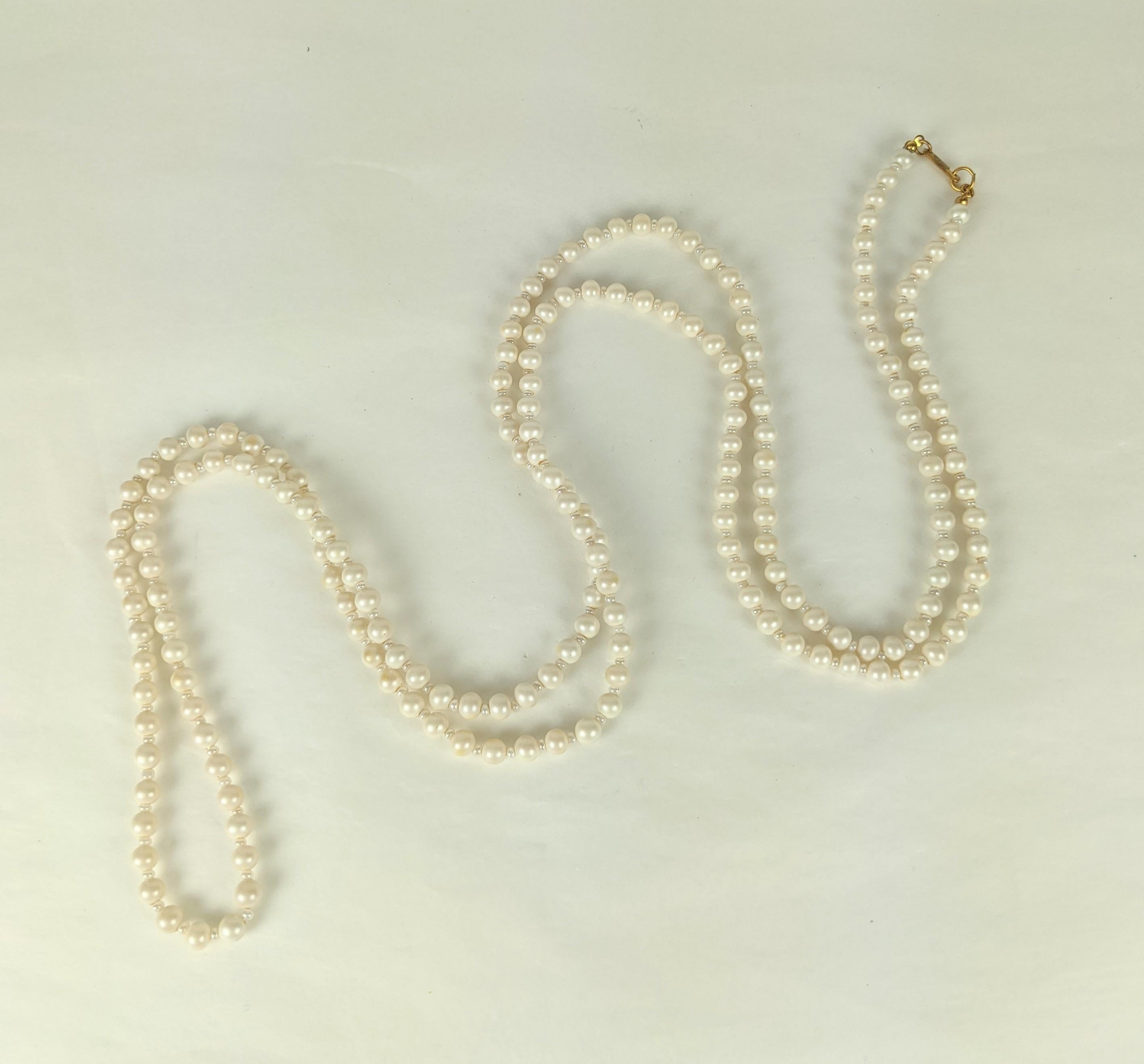Miriam Haskell Long Faux Pearl Necklace of freshwater pearls with signed clasp. Long strand that can be wrapped several times. 52