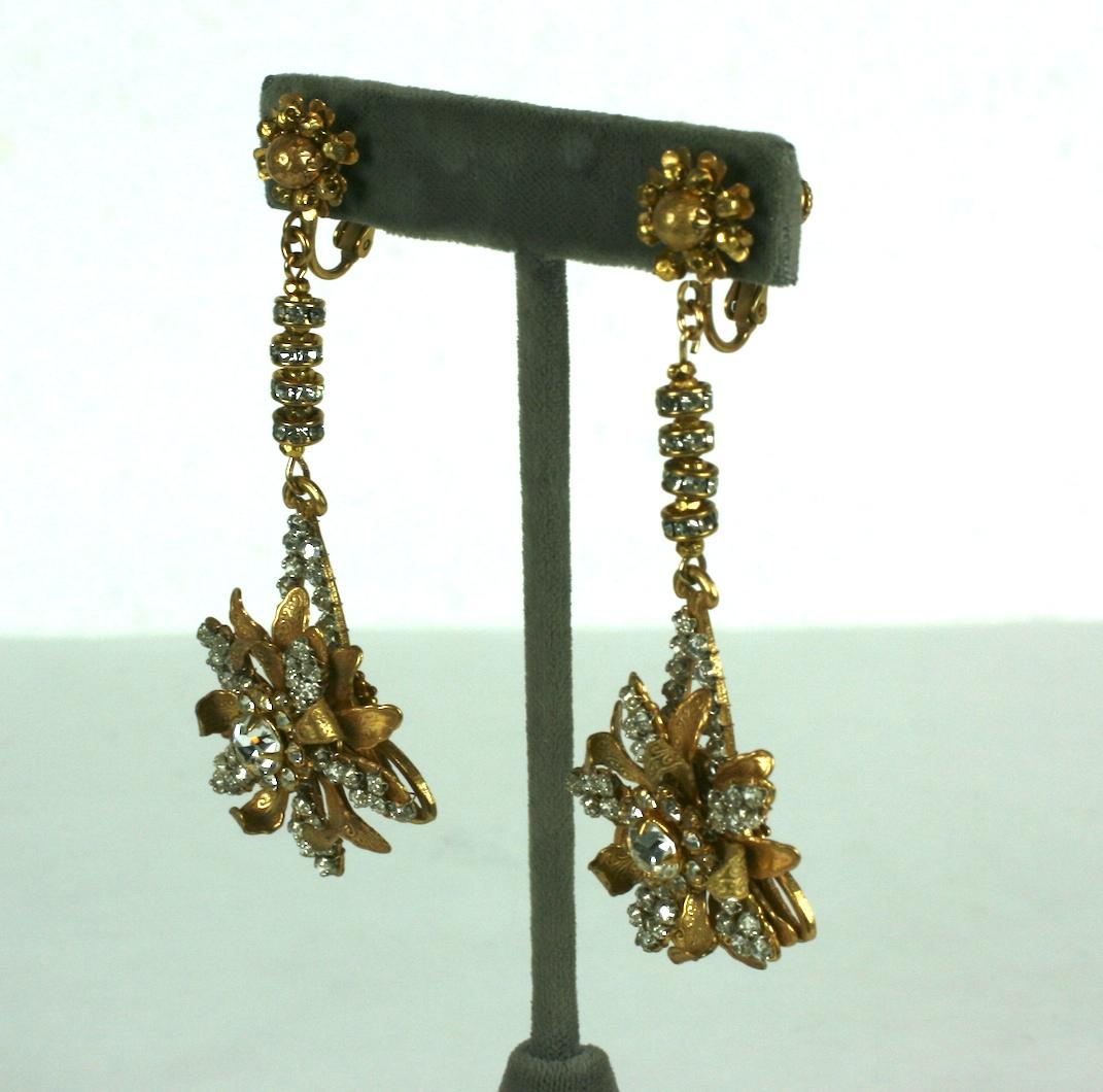 Impressive Miriam Haskell's signature Russian Gilt long pendant Victorian revival ear clips. Composed of hand sewn crystal rose montee flowerheads hanging off crystal rondelle and gold plated cut steel beads. The flower centers are of a large