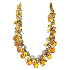 MIRIAM HASKELL necklace book piece 1950s with many cut yellow glass balls