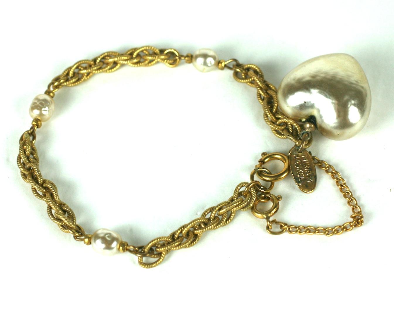 Miriam Haskell large faux baroque heart shape pearl fob bracelet. Of Russian gilt chain with signature baroque pearl and gilt cut steel bead spacers. Excellent condition. Signed.
Length  7 1/2
