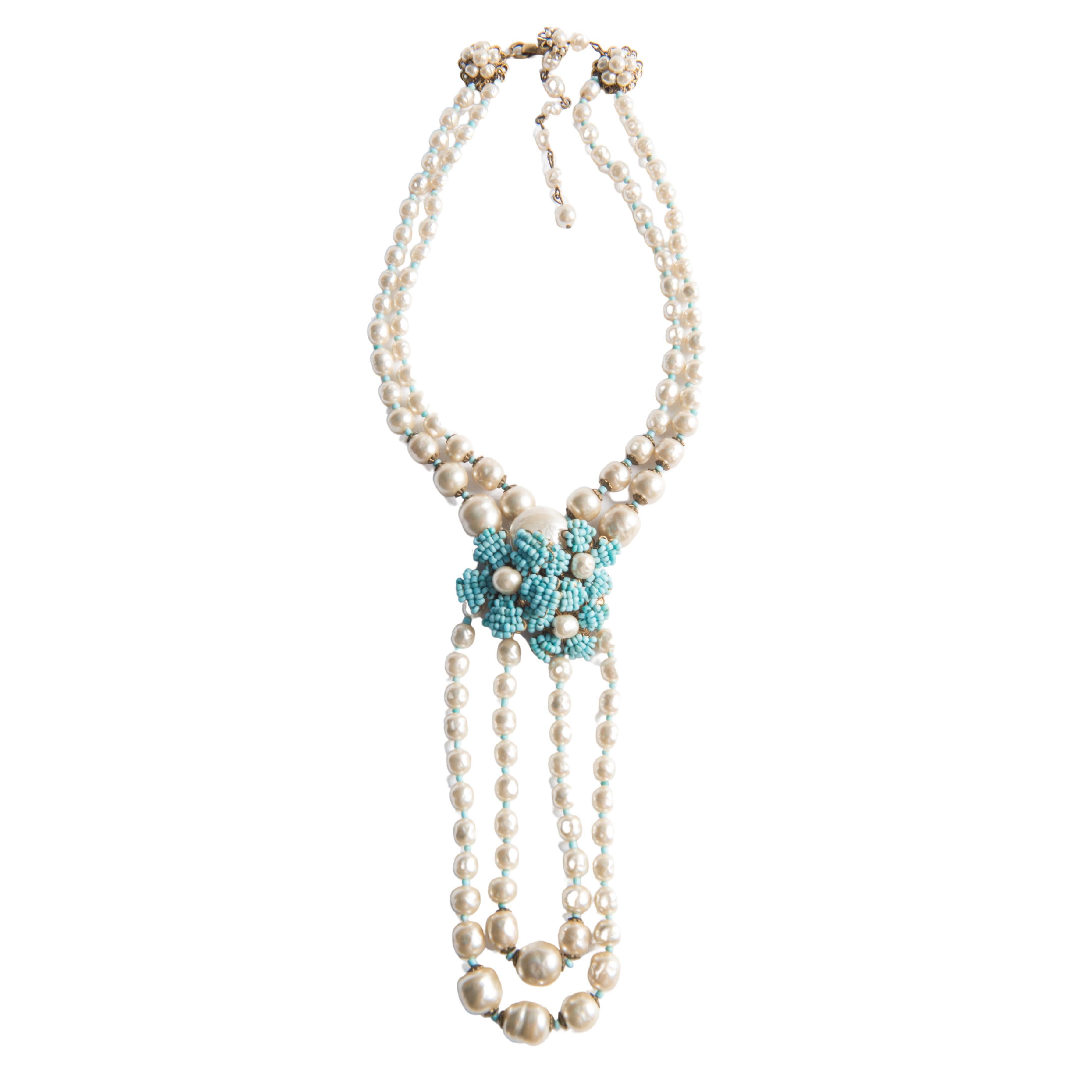 A Miriam Haskell Stunning pearl and turquoise beaded necklace and bracelet set. Necklace cluster and hanging lower double pearl strands are 6