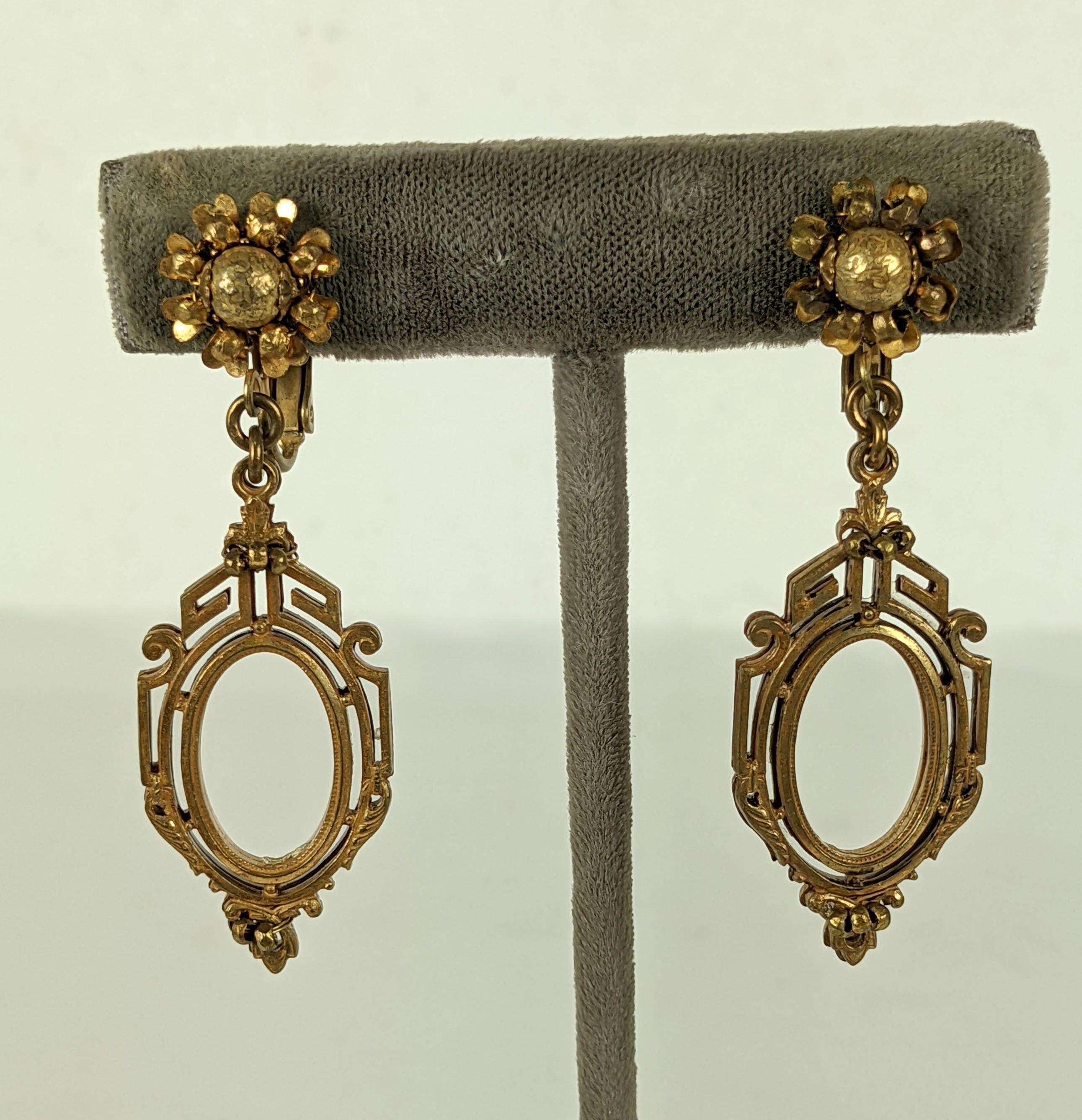Miriam Haskell Victorian Revival earclips of signature Russian Gilt plate. The  Victorian style drop  Revival pendant hangs from a classic Miriam Haskell flower head of gilt plate cut steel beads with small textured brass bead centers. Clip back