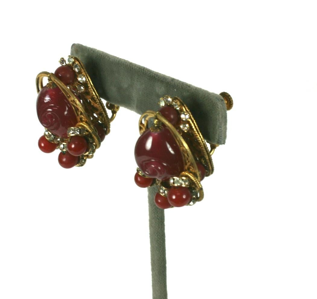 Miriam Haskell signature Russian Gold filigree and french handmade pate de verre faux ruby bead earrings. Hand sewn with small crystal rondels, gilt cut steel beads and flowerhead filigrees. 
Clip back fittings. Excellent Condition, Signed.
Length 1