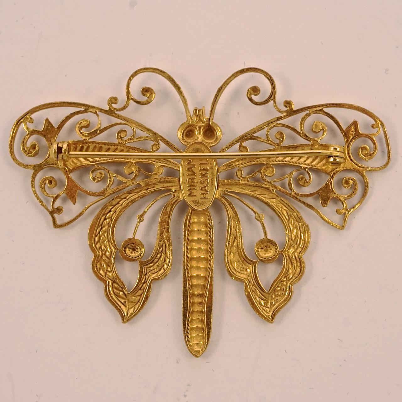Miriam Haskell beautiful Russian gold plated ornate butterfly brooch. Measuring width 6.2 cm / 2.4 inches by length 4.7cm / 1.85 inches. The brooch is in very good condition.

This is a lovely butterfly brooch with the Haskell Russian gold patina.