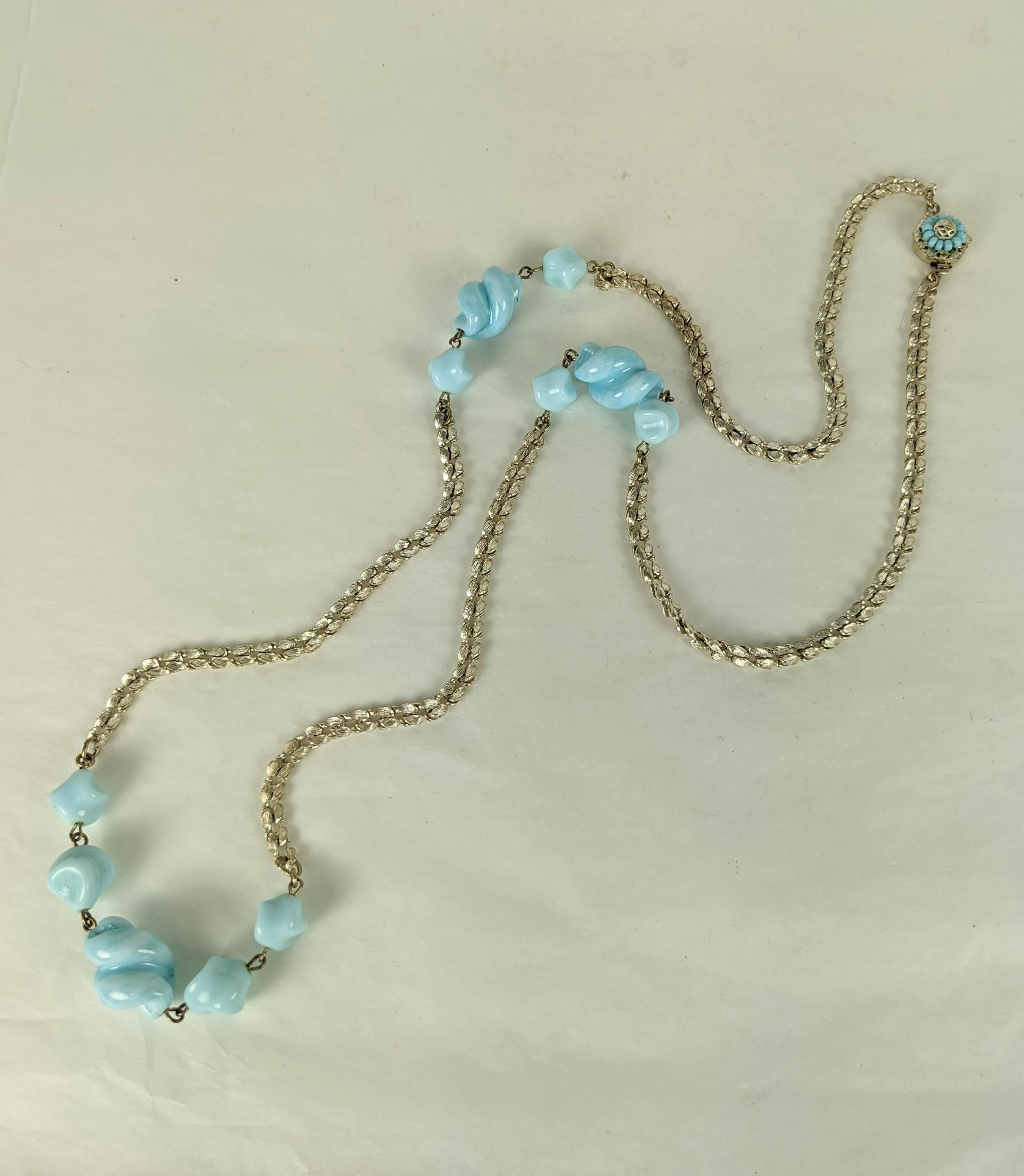 Miriam Haskell pale turquoise blue pate de verre hand made cork screw bead sautoir. The textured woven chain of silver plate. Signature Miriam Haskell hexagon clasp of hand sewn turquoise seed beads and silvered filigrees. Excellent Condition.