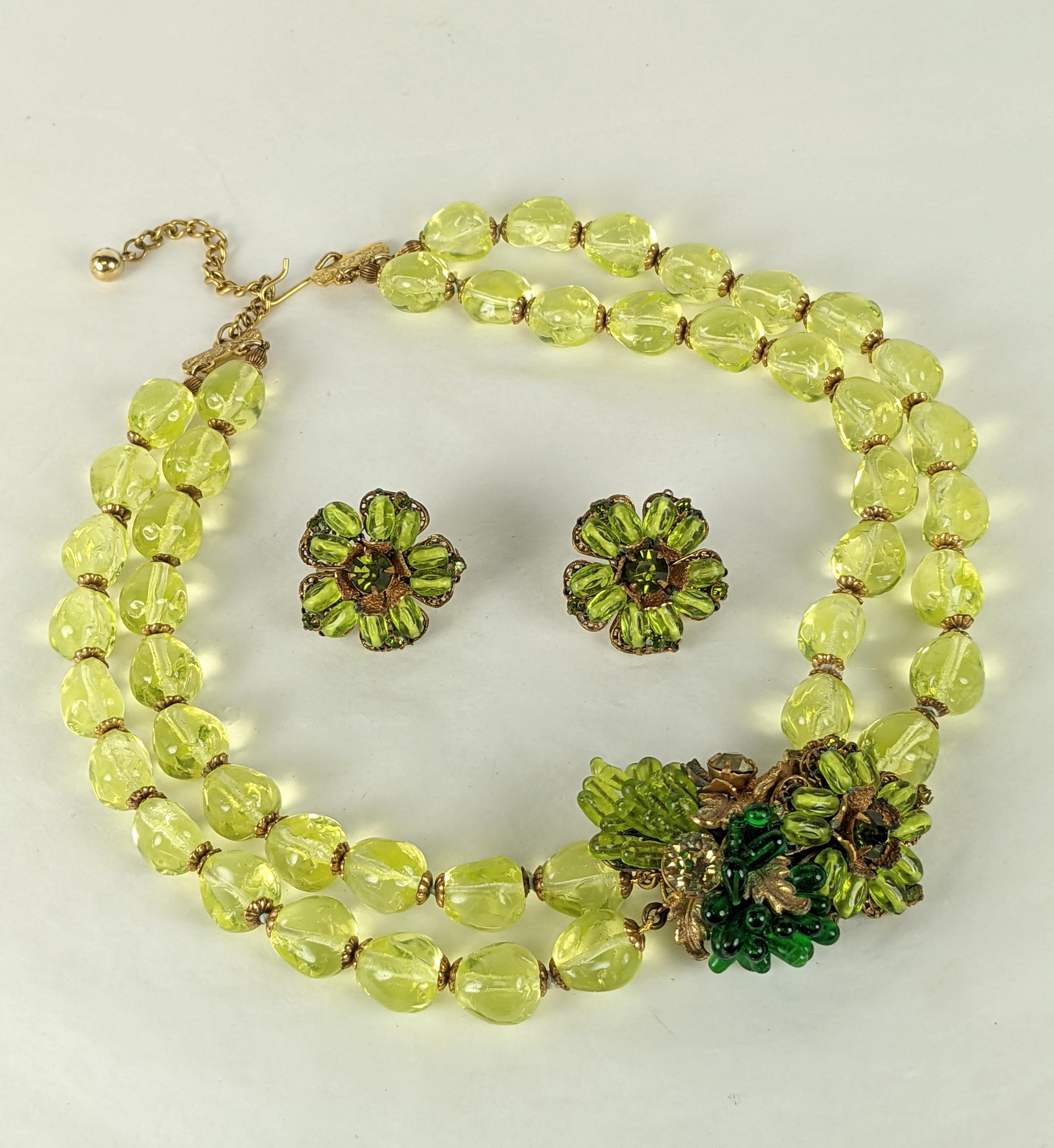 Miriam Haskell Vaseline Glass Pate De Verre Necklace and Earrings from the 1930's. 2 strands of vaseline glass with centerpiece of embroidered flowers, stamen and pastes in varying tones of green hand made pate de verre glass. Matching clip