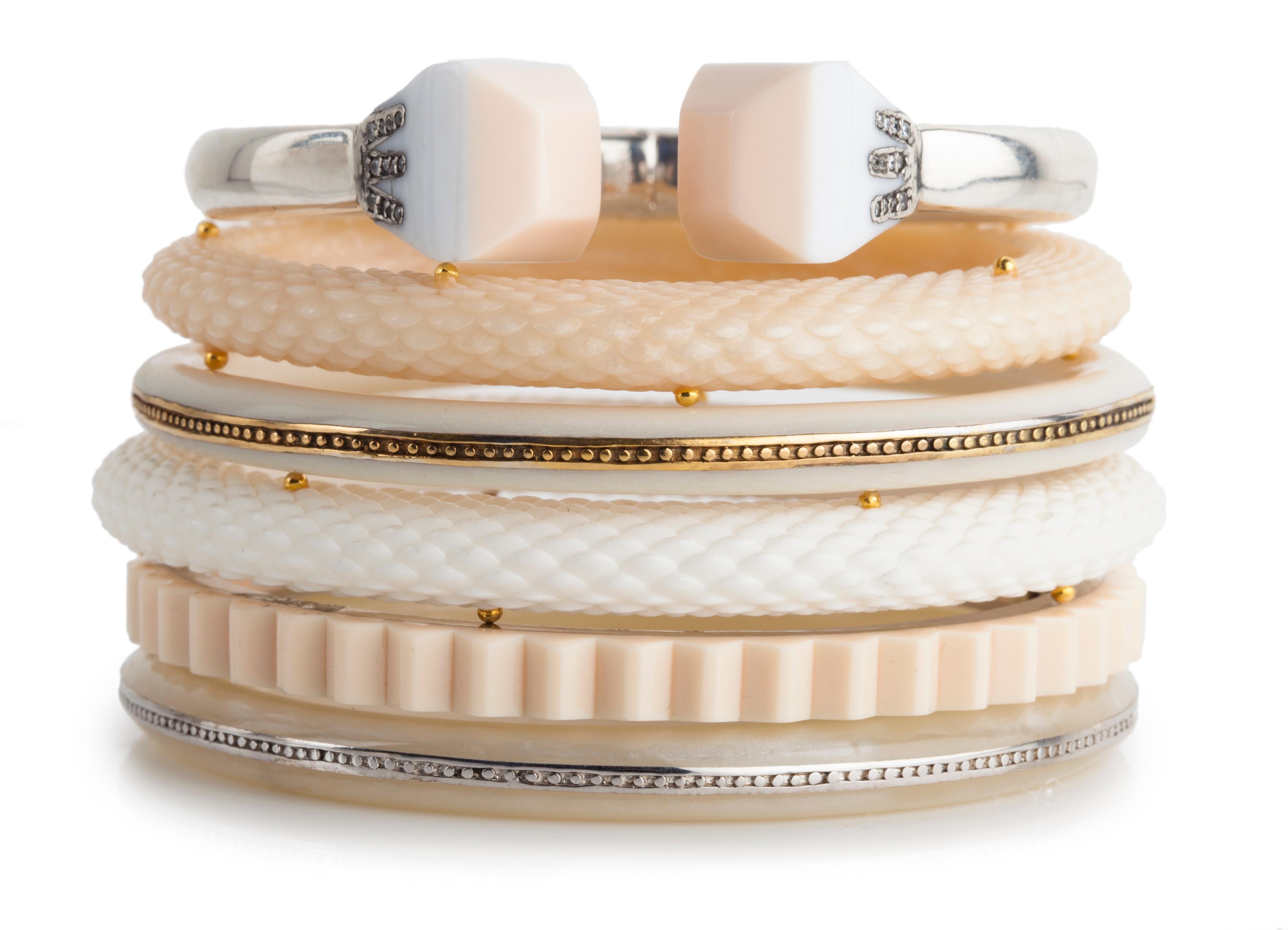 Fantastic Art Deco - Miriam Salat (MIRIM) cuff Bangle features ivory / cream color resin with sterling silver. 
Bracelet is a basic stacking piece and has a magnetic closure; measures apx. 6-1/2 inches in circumference and apx. Half an inch in