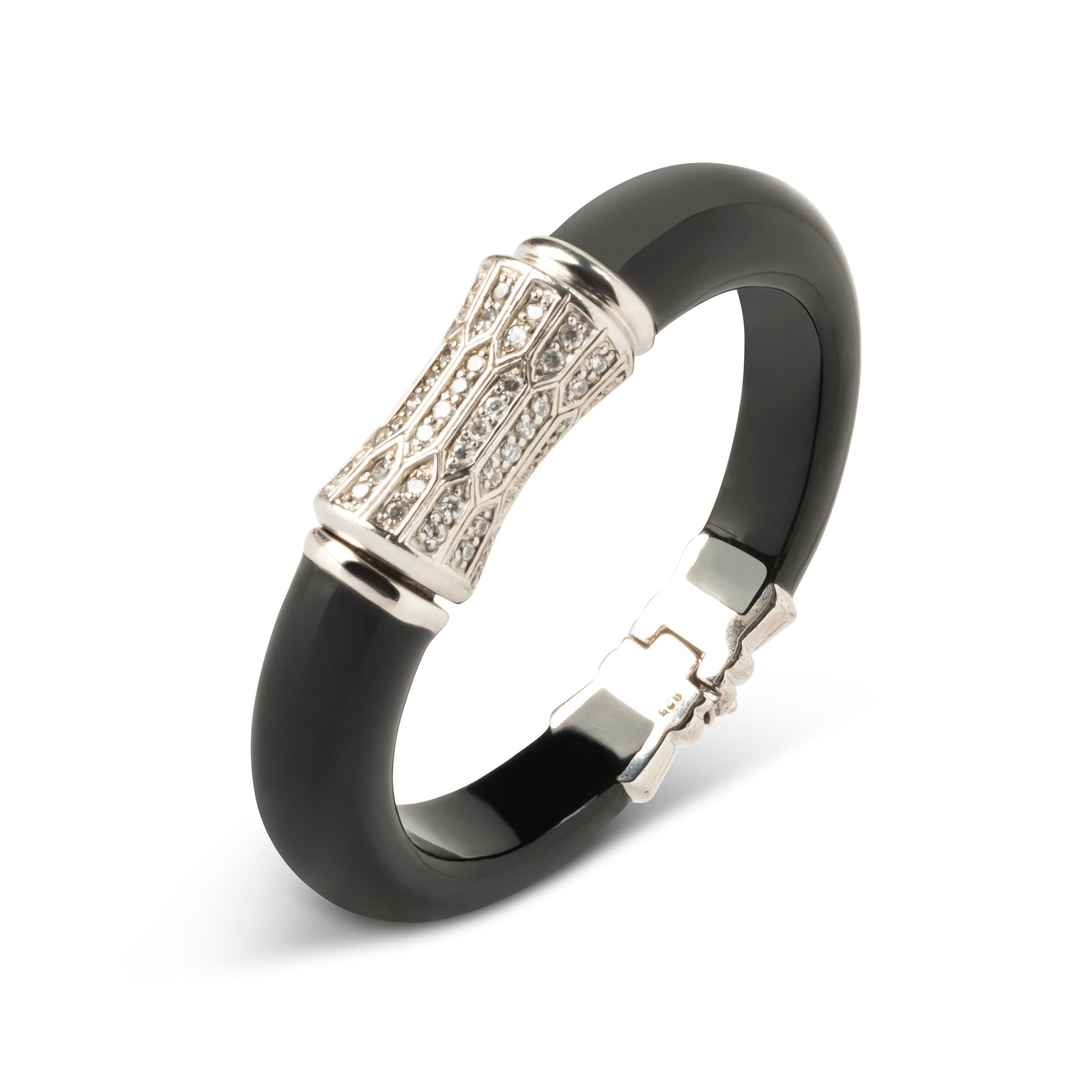 Fantastic Art Deco - Miriam Salat (MIRIM) bangle features black color resin with sterling silver and. White Topaz full facet round brilliant, prong set.
Bracelet has a magnetic closure; measures apx. 6-1/2 inches in circumference and apx. 1 inches