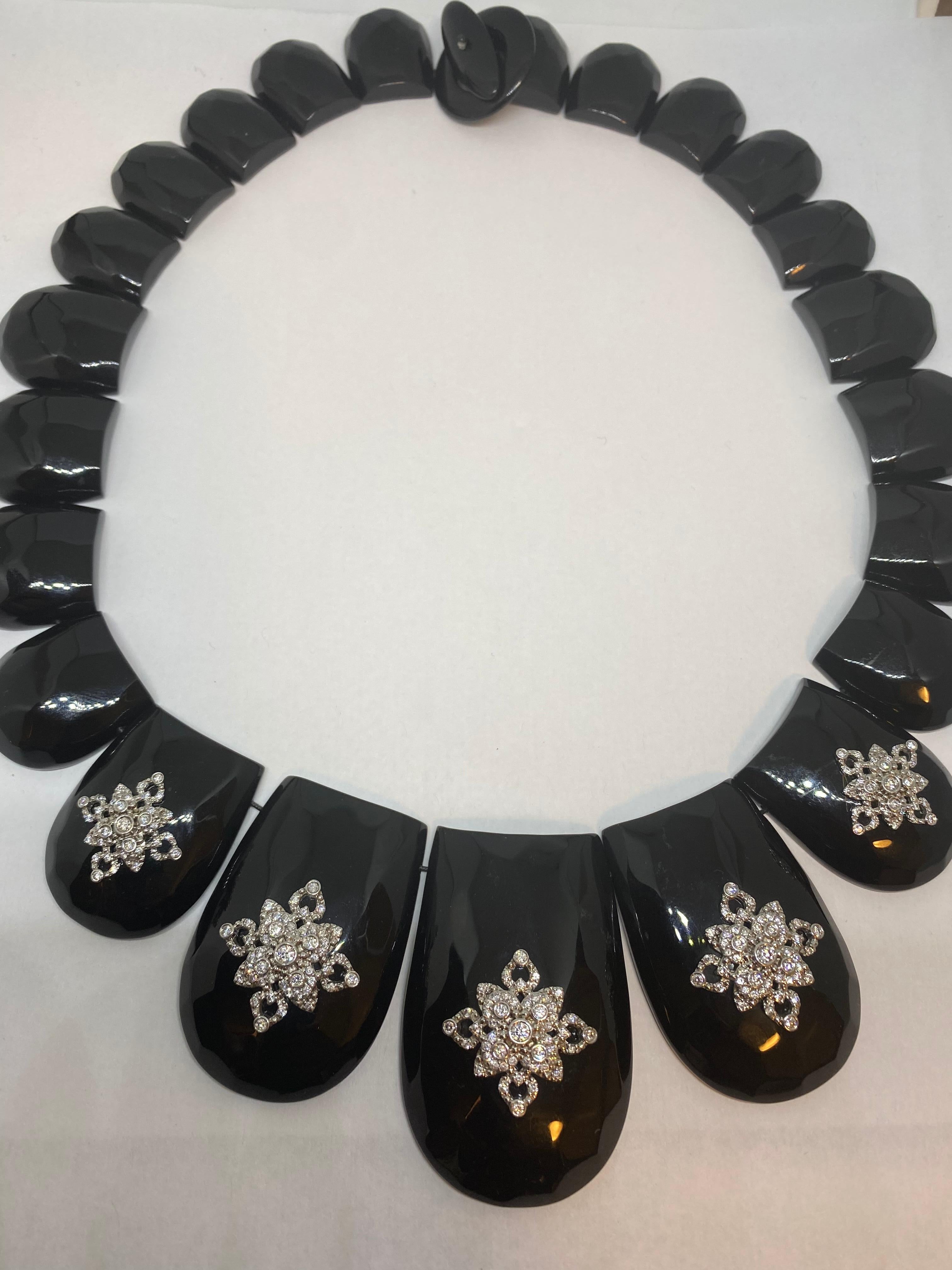 Miriam Salat choker features black resin with vintage sterling silver.
Fantastic option for an evening dinner or even a gala. 
Cubic zircon full diamond facet rounds, prong set.
necklace is chocker length.
Measures apx 16 inches
Total weight is
