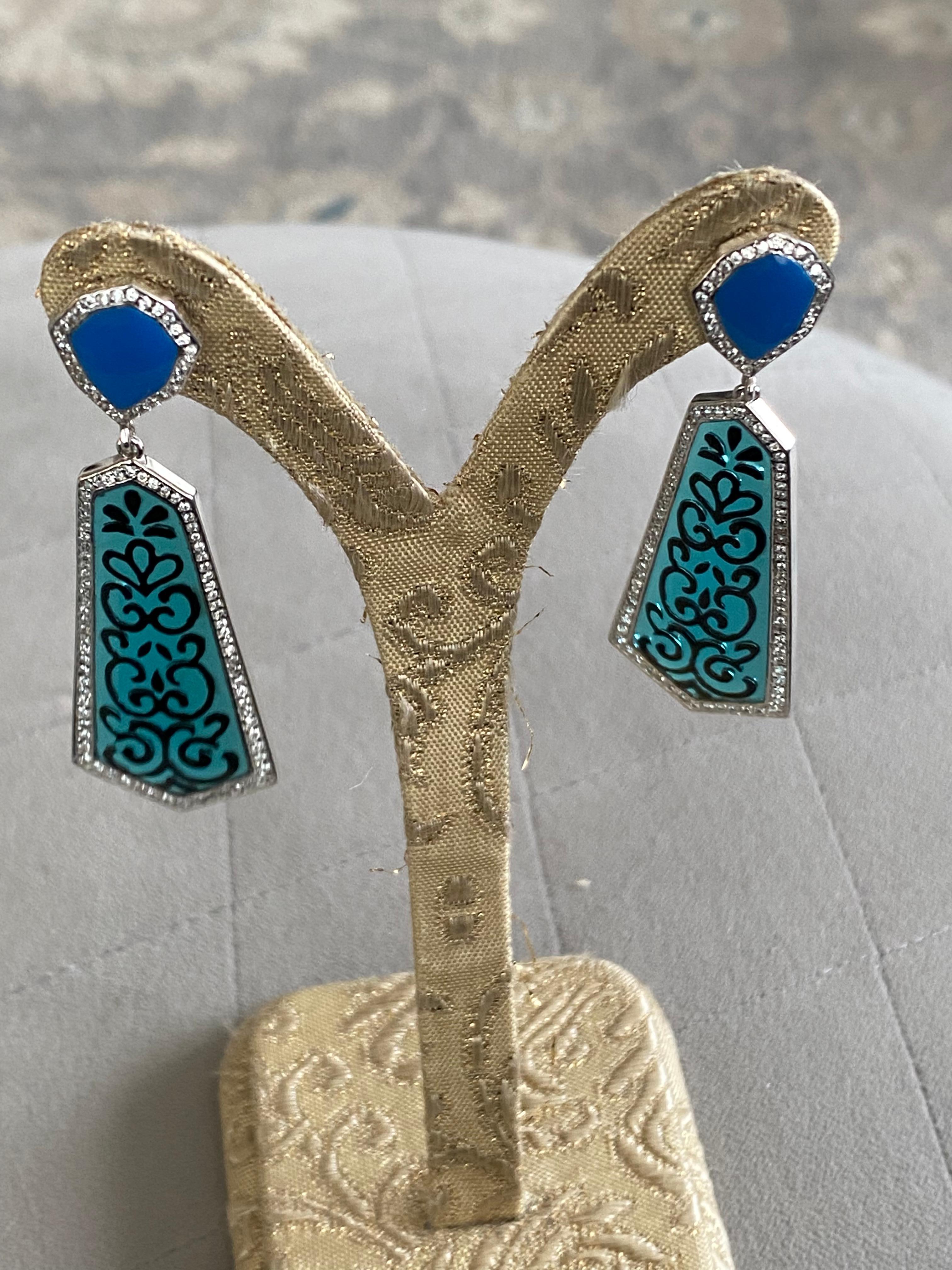 Miriam Salat Blue Filagree Resin and Sterling Silver Earrings With White Topaz  
Miriam Salat Drop Earrings - This fantastic Miriam Salat earrings features filagree blue resin with  sterling silver.
Channel set Zircon accents on the body and hand