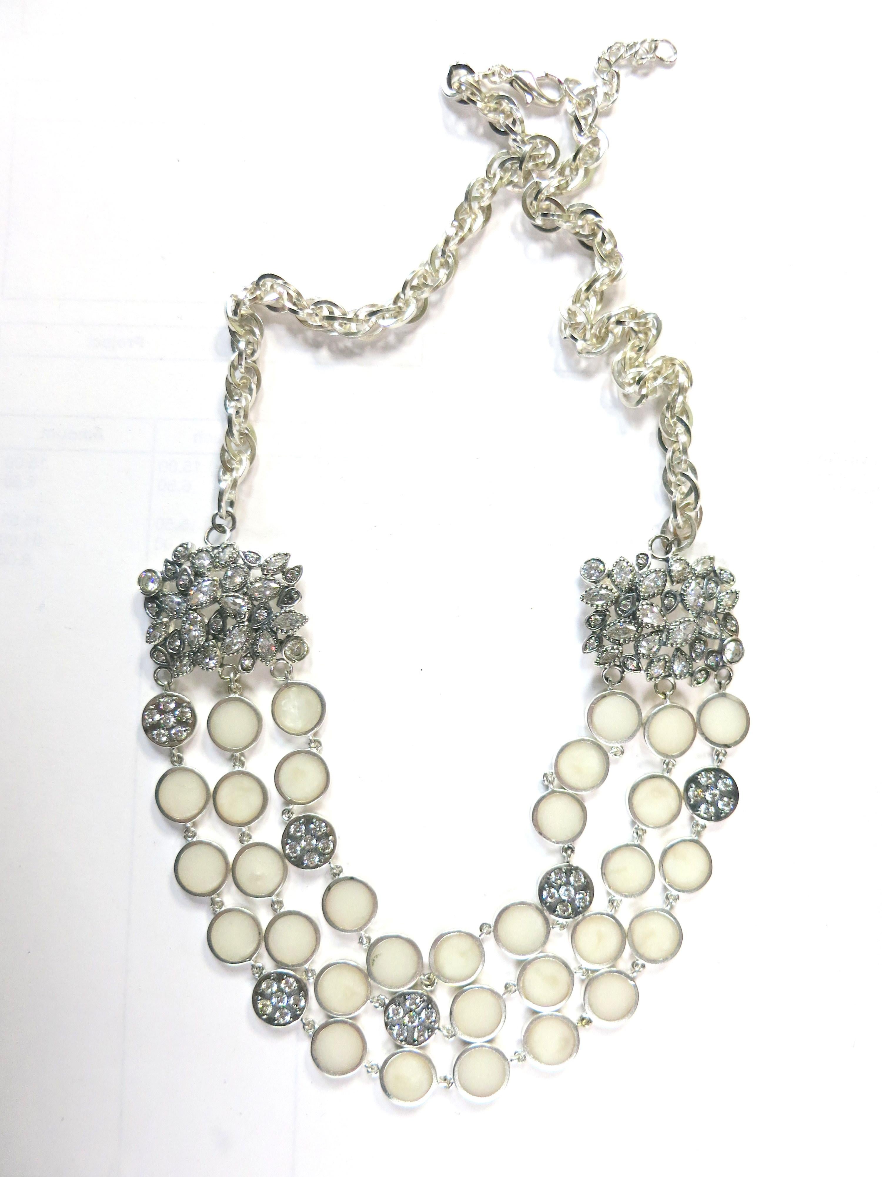 Miriam Salat choker features cascade resin with vintage sterling silver.
Cream / Ivory color resin 
Cubic zircon full diamond facet rounds, prong set.
necklace is chocker length.
Measures apx 16 inches
1/2 inches in width. Total weight is approx 150