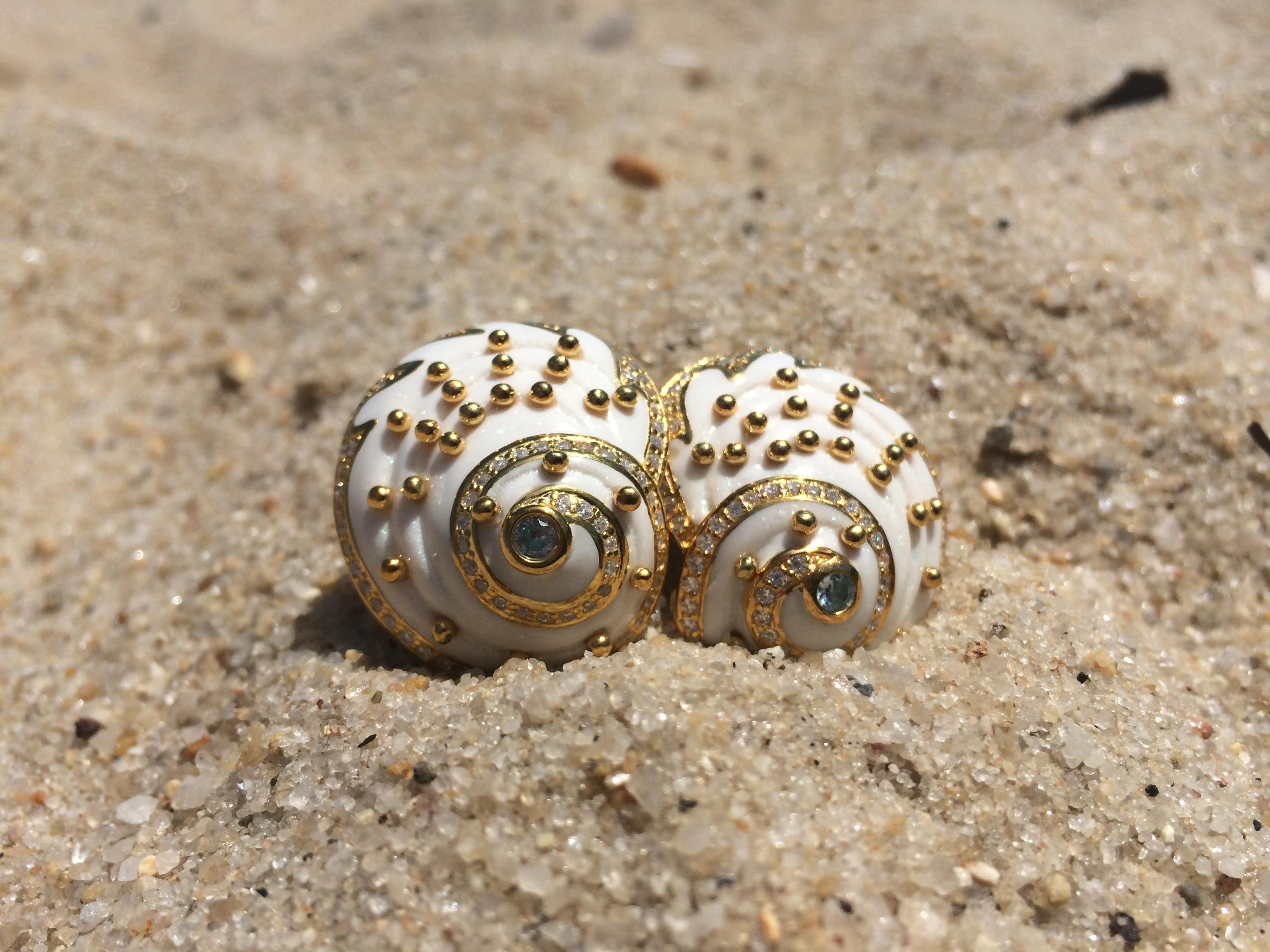 Seashell earrings by Miriam Salat.
Semi precious Starling Silver with Blue and White Topaz and Gold plating.
Mint green resin and golds studs. 
Signed 
Comes with a Miriam Salat pouch. 