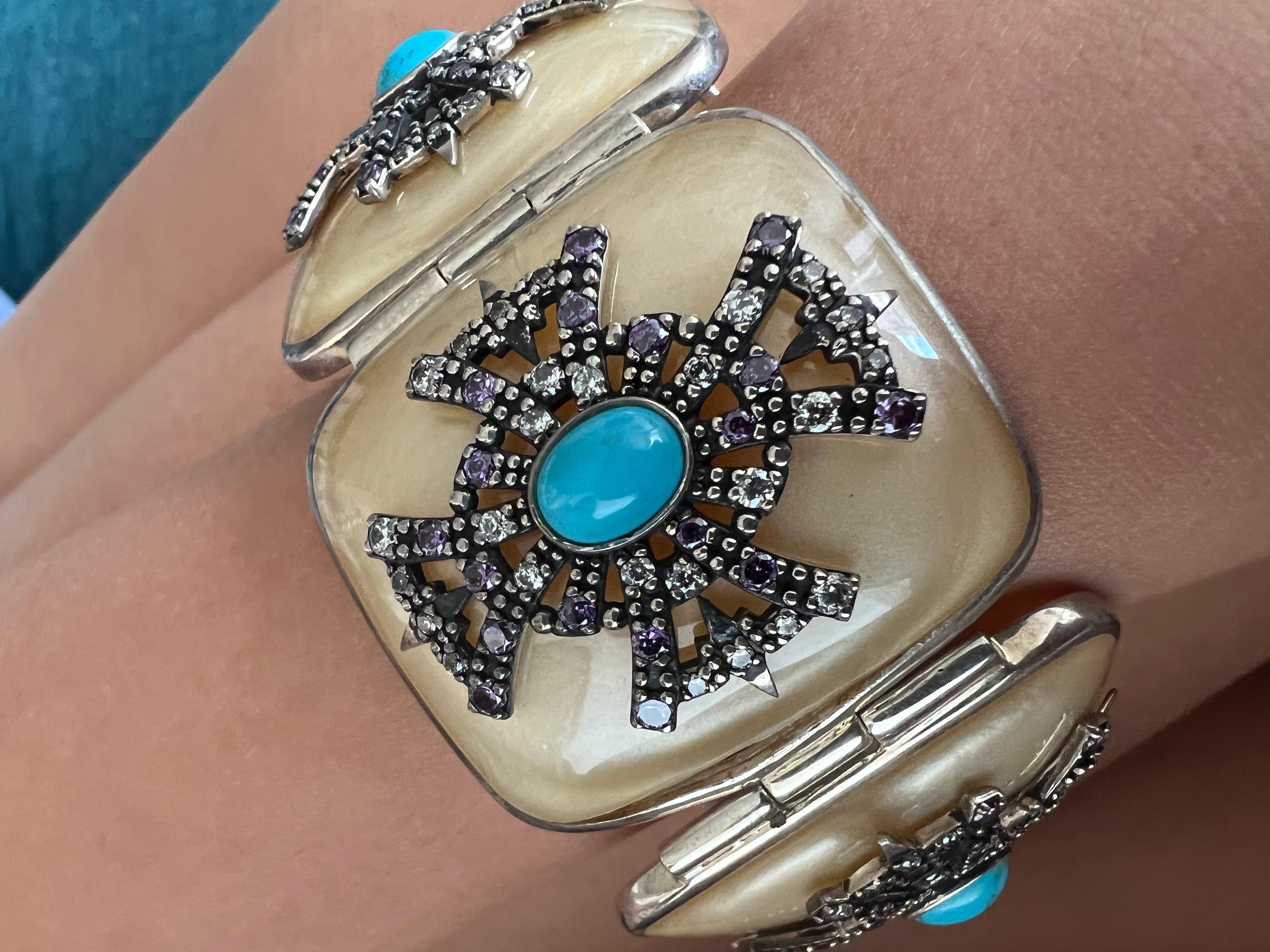 Miriam Salat link cuff. 
Vintage Sterling sliver.
Purple Topaz 
White Topaz 
Turquoise
All topaz stones are full facet round brilliant and all are hand set 
Milky translucent resin 
MRM singed 
Comes with a Miriam Salat pouch. 
Not many made 1 out