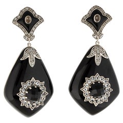 Boucles d'oreilles en goutte « MRM » de soirée Miriam Salat en résine noire et topaze blanche