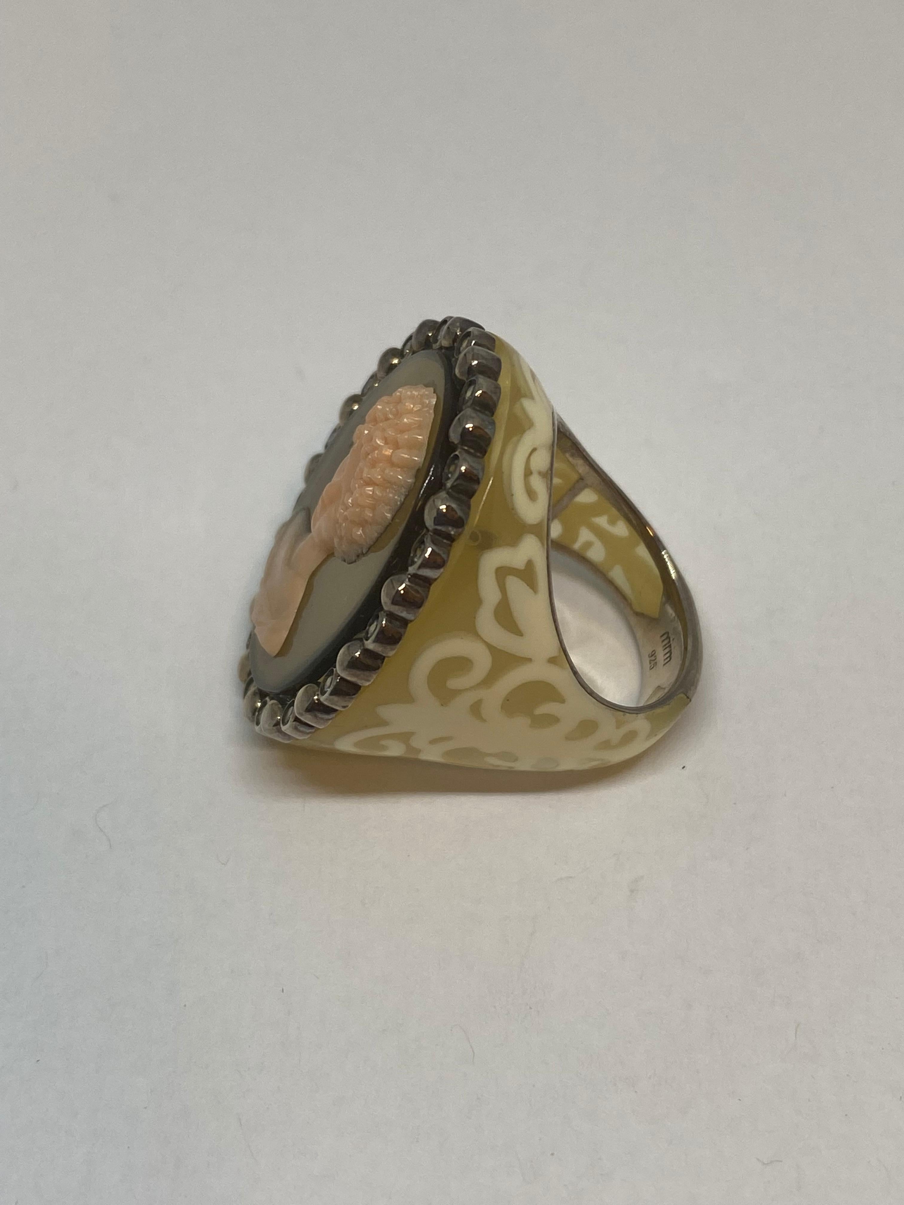 Miriam Salat (MRM) coffee two tone resin ring  - This fantastic Miriam Salat ring feature a Mythological Roman Cameo design made up of white, honey, coffee Resin.
Salomon resin to simulate coral. 
With full facet Zircon stones, set in sterling