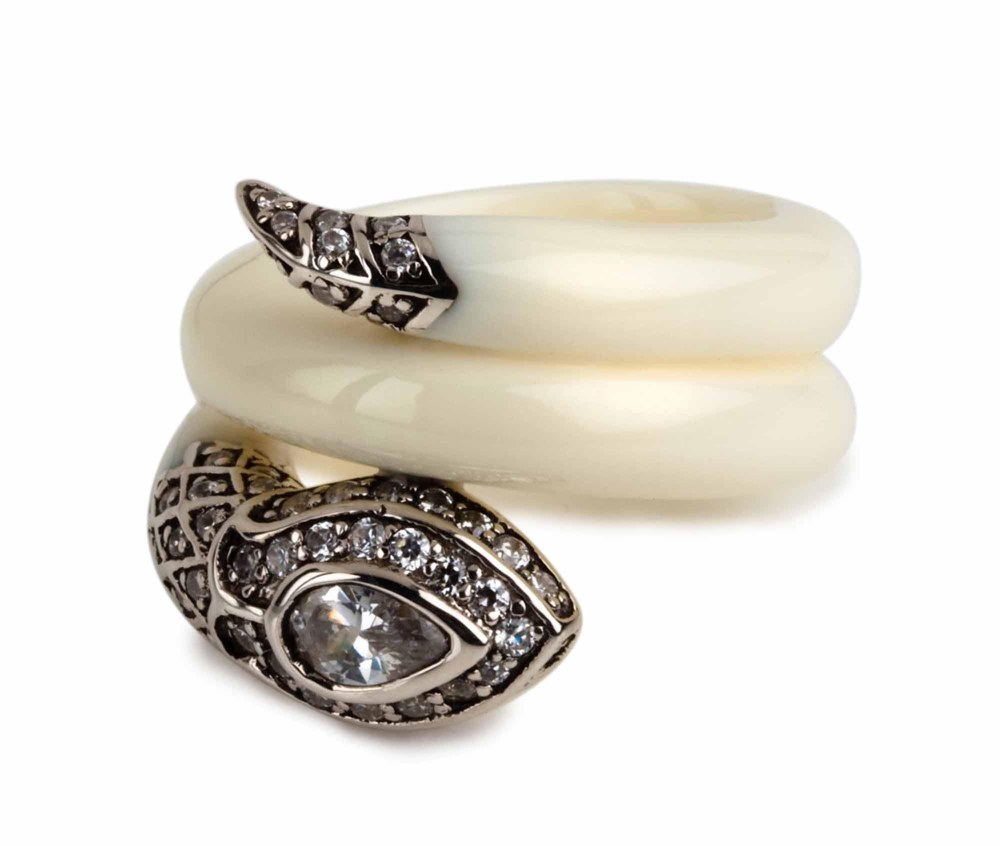 Miriam Salat Serpentine Cleopatra Flex ring 
Beautiful Serpentine flexible ring with fantastic design and attention to detail. 
Ivory cream resin.
Sterling silver flex and adjust ring. 
Blackened sliver plates. 
Full cut White Topaz stones accents