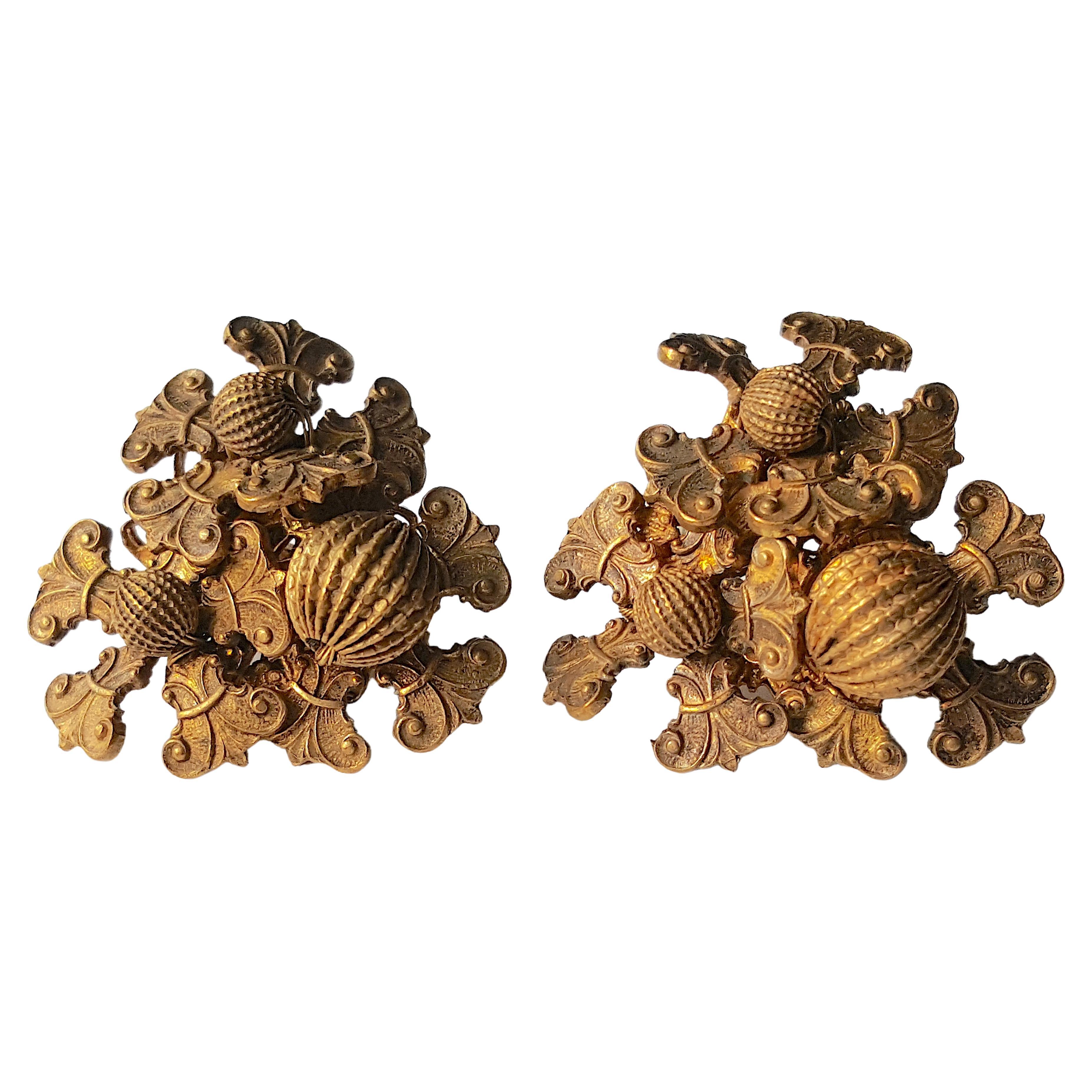 With the earliest brand signature from 1947-1949, these Miriam Haskell (1899-1981) hand-wired Russsian-gilt brass floral French-wire-clip earrings were created by her first designer Frank Hess. On the metal ear-pad attached to their hallmark