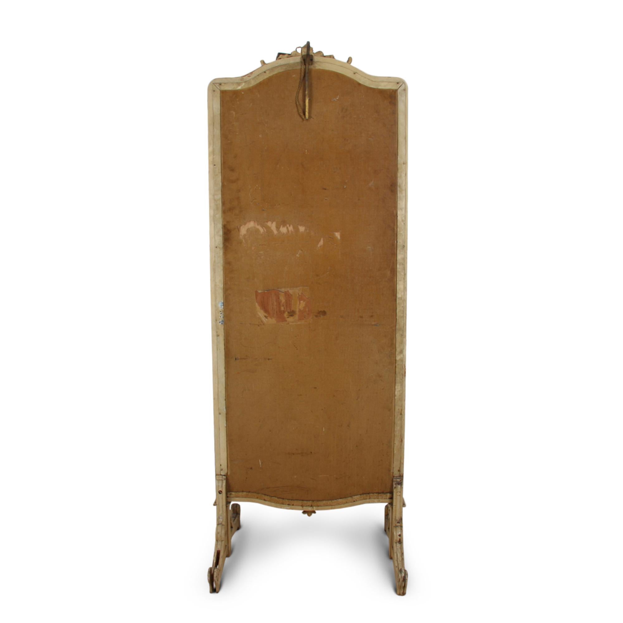 Illuminated by a cantilevered brass lamp, this fantastic floor-standing triptych dressing mirror by the French maker Miroir Brot dates from 1920s, Paris. With original paint and mirror plate. (Maximum width is 122cm when open, minimum width is 68cm