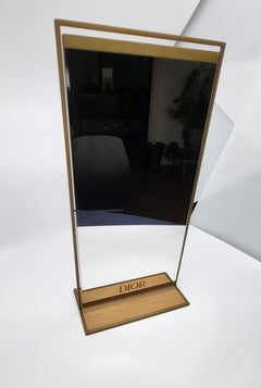 Miroir Christian Dior en métal doré et socle couleur bois Français Modernity