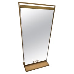 Miroir Christian Dior en métal doré et socle couleur bois Français Modernity