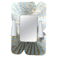 Miroir en marqueterie de zinc et de laiton et ses appliques