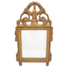 Miroir mural d'époque Louis XVI en bois sculpté et doré
