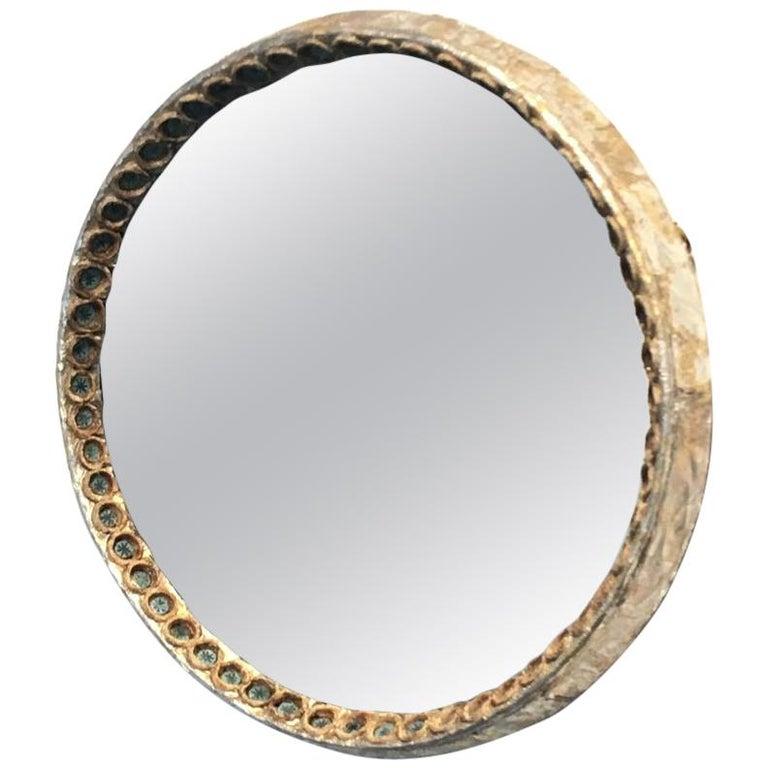 Line Vautrin's mirror
Circular mirror, made with ocher Talosel resin and blue chips.
Signed 