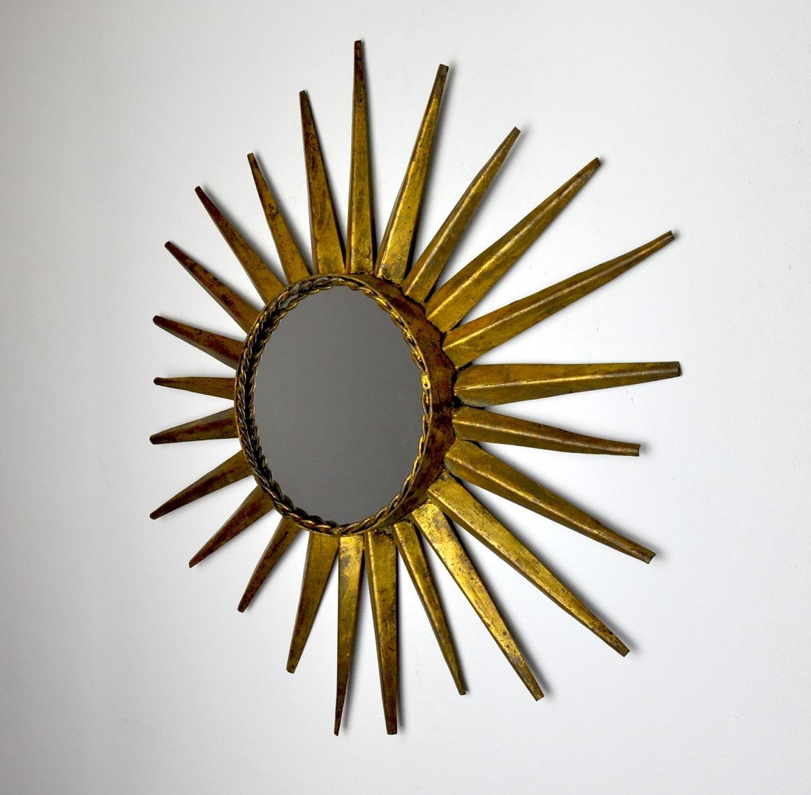 Superb and rare golden sun mirror with gold leaf designated and produced in italy in the 1970s.

Very beautiful forge work, superb dimensions, unique object that will decorate and bring a real design touch to your interior.

Ref: 777.