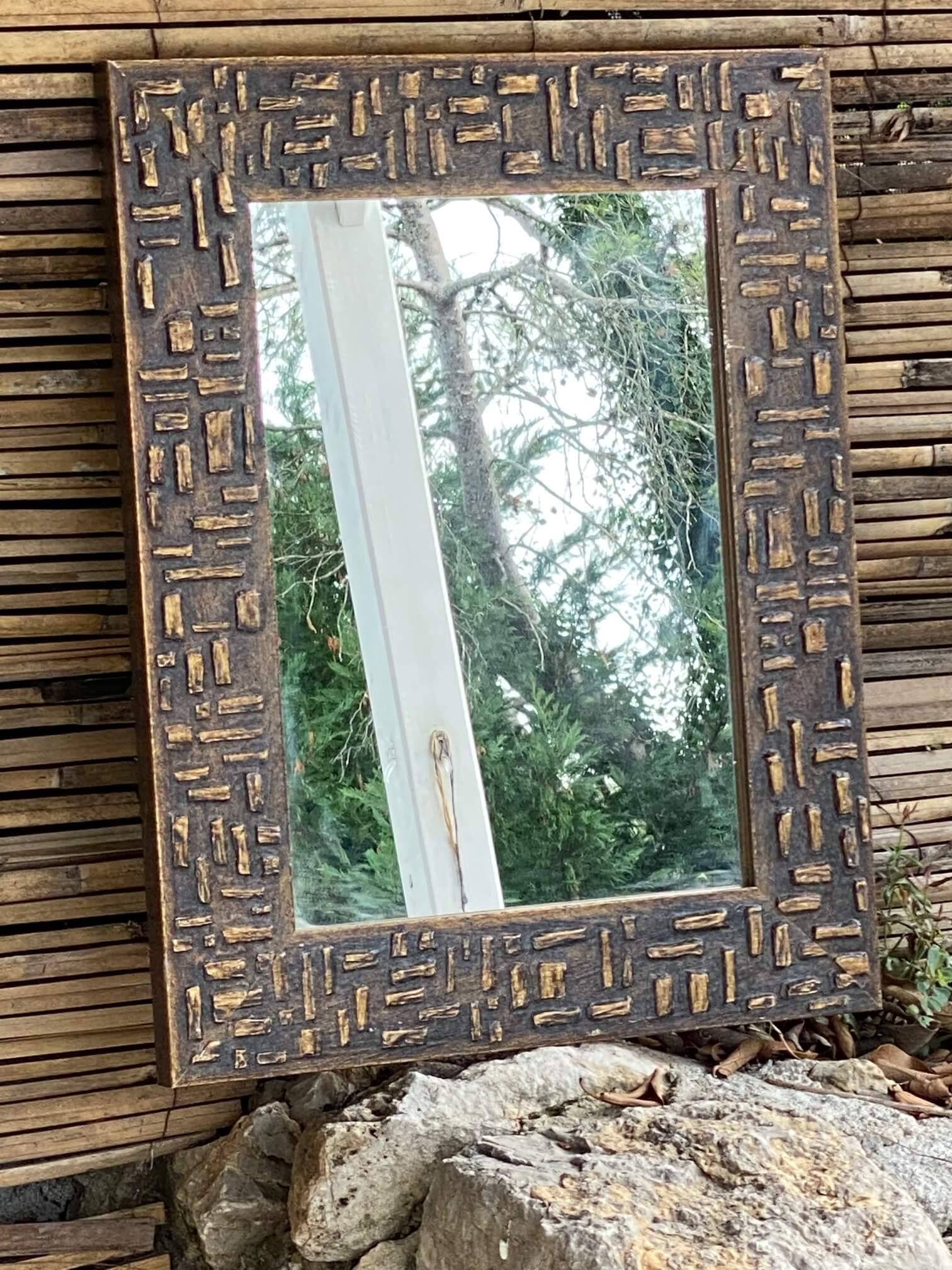 This mirror has been made in the 1970s in France. It is a Patina, made with a painting on the wood.