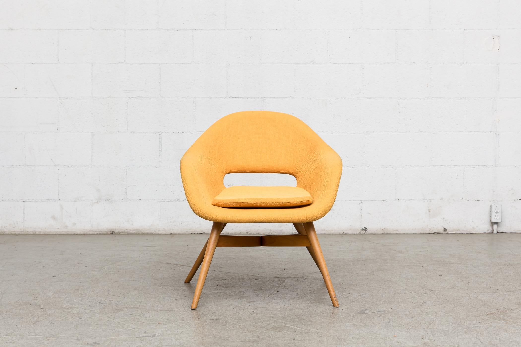 Saarinen Style Mid-Century Modern bucket chairs with oval cut-outs by Miroslav Navratil. Newly upholstered in sunshine yellow fabric. Original birch frame in good original condition. Others available in assorted colors.