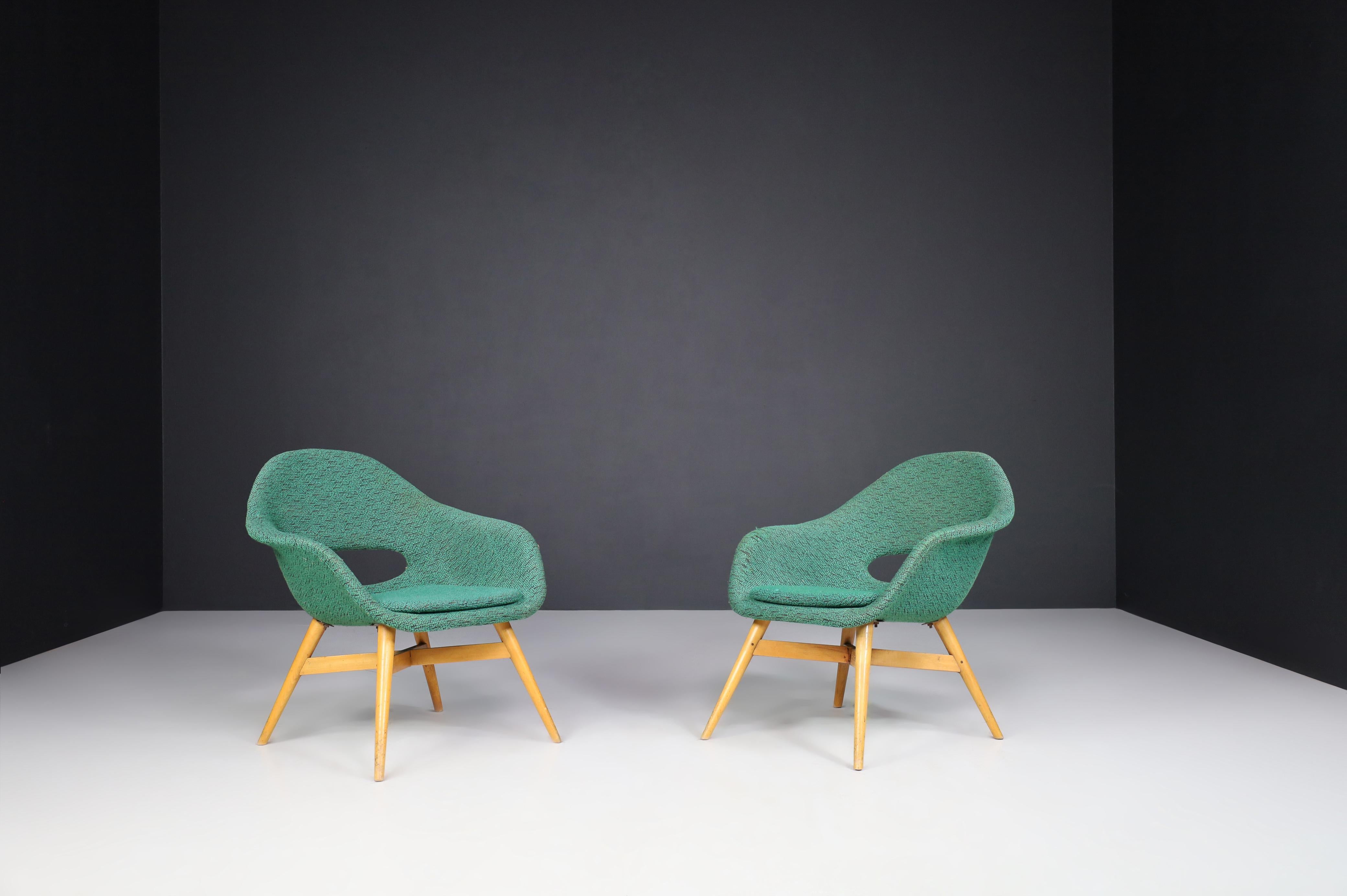Miroslav Navratil Easy Chairs in Original Fabric 1960.

Lovely set of two easy chairs by Miroslav Navratil, manufactured in Czech by Cesky Nabytek circa 1960. These chairs have a beech plywood base and a fiberglass shell with original fabric