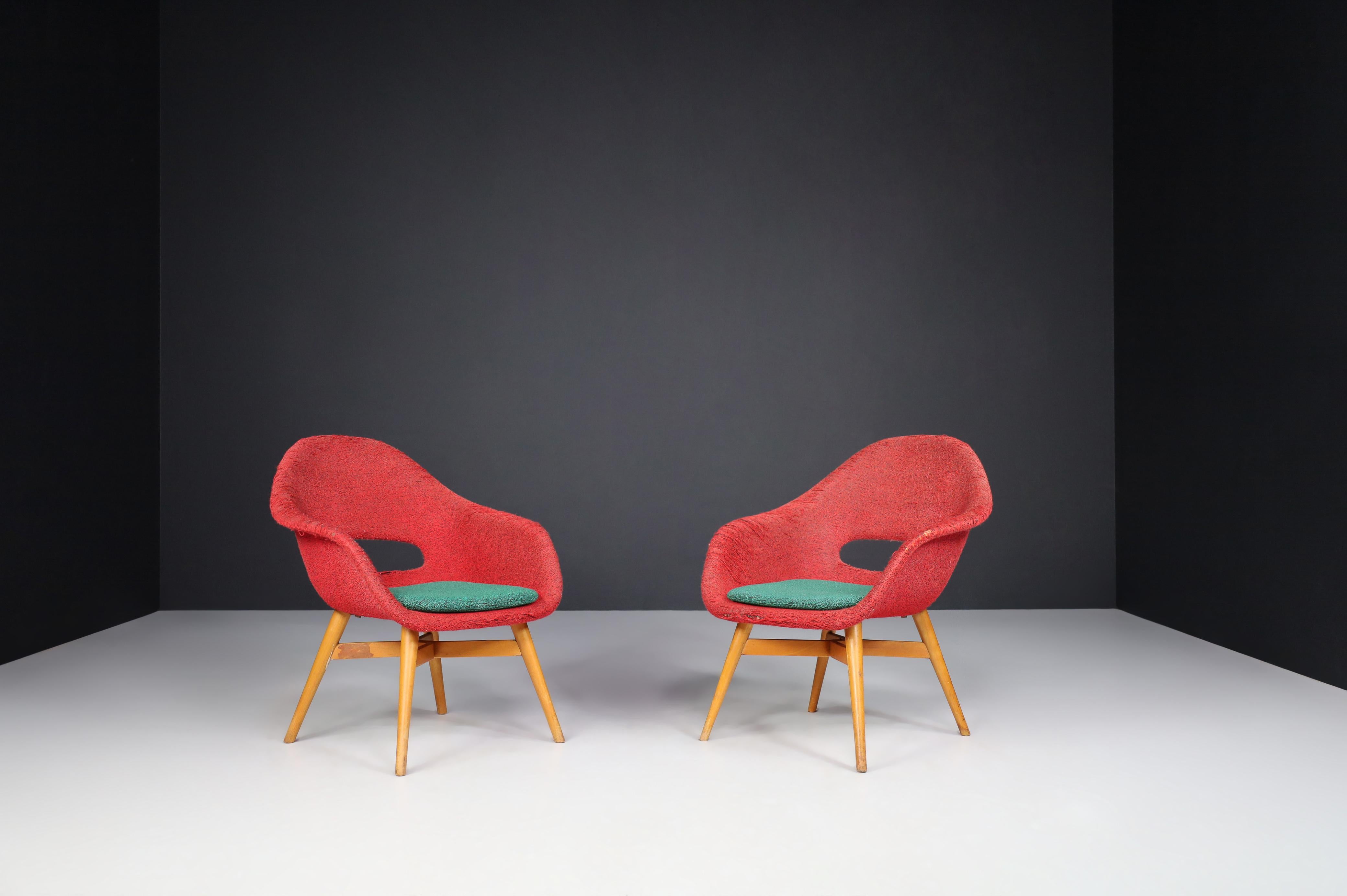Miroslav Navratil easy chairs in original fabric 1960.

Lovely set of two easy chairs by Miroslav Navratil, manufactured in Czech by Cesky Nabytek circa 1960. These chairs have a beech plywood base and a fiberglass shell with original fabric