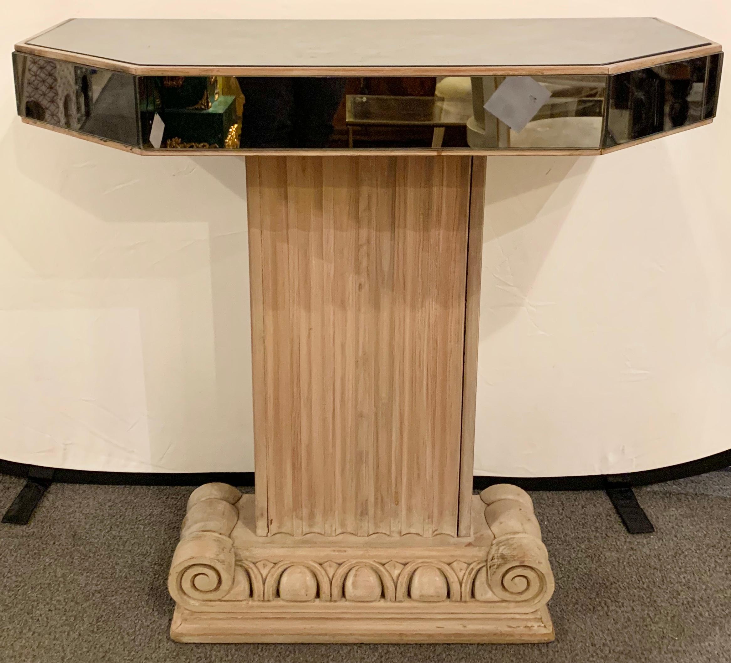 Lorin Jackson for Grosfeld house mirror and cerused oak console 
Neoclassical mirrored top console table, canted print corners on inverse fluted ionic column base in limed oak. Executed by Grosfeld House.
American, circa 1940.
  