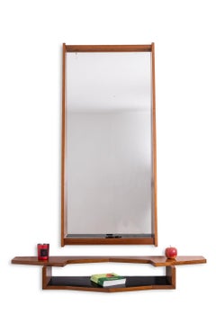 Mirror and mahogany console. 1970s.