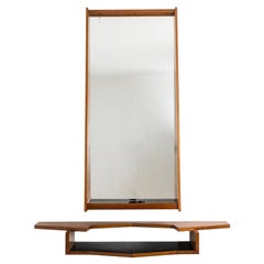 Mirror and mahogany console. 1970s.