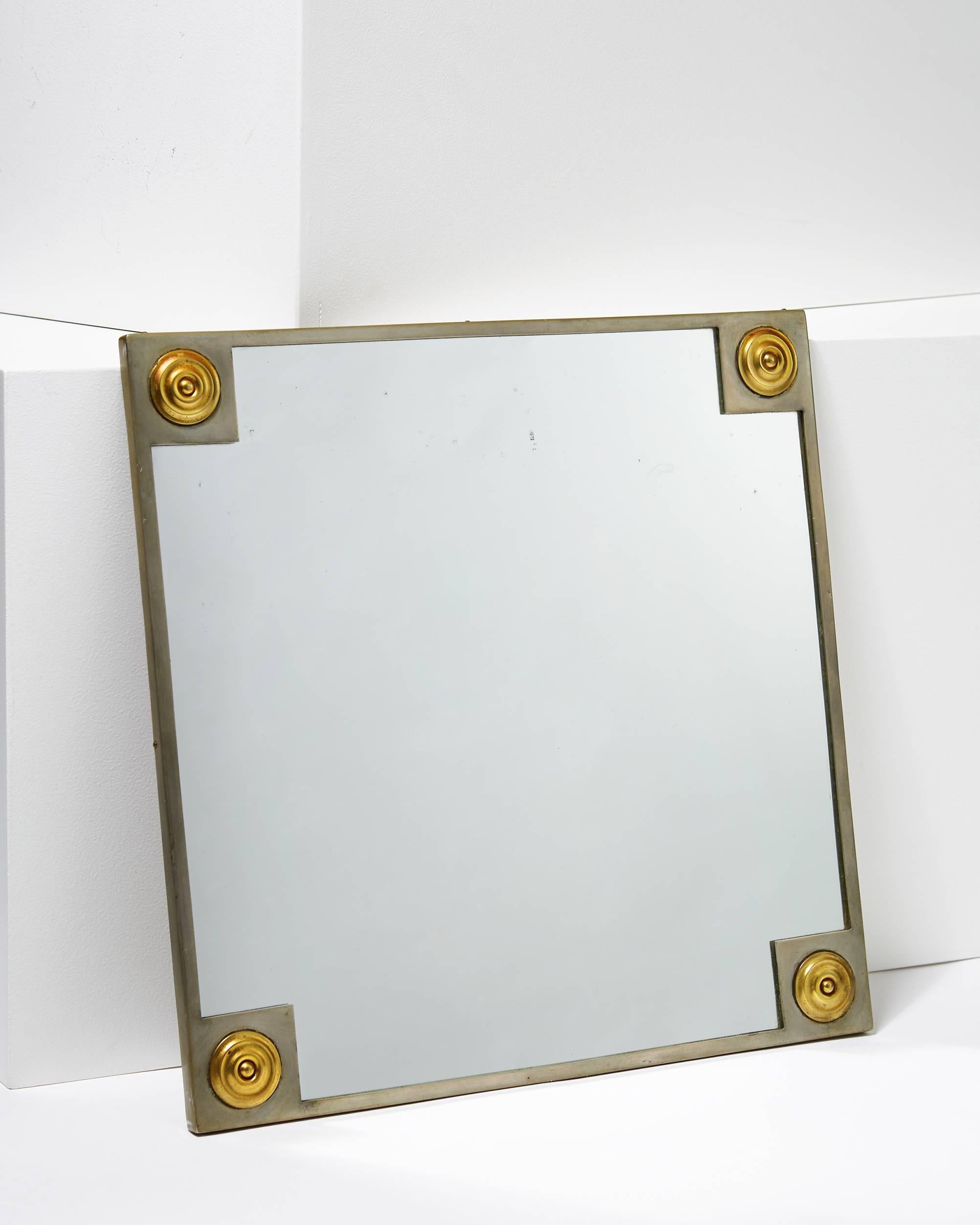 Mirror, anonymous, for Svenskt Tenn,
Sweden. 1928.

Pewter, brass, mirrored glass.

Marked 'Stockholm B8'.

Dimensions:
H: 40.5 cm/ 16''
W: 40.5 cm/ 16''