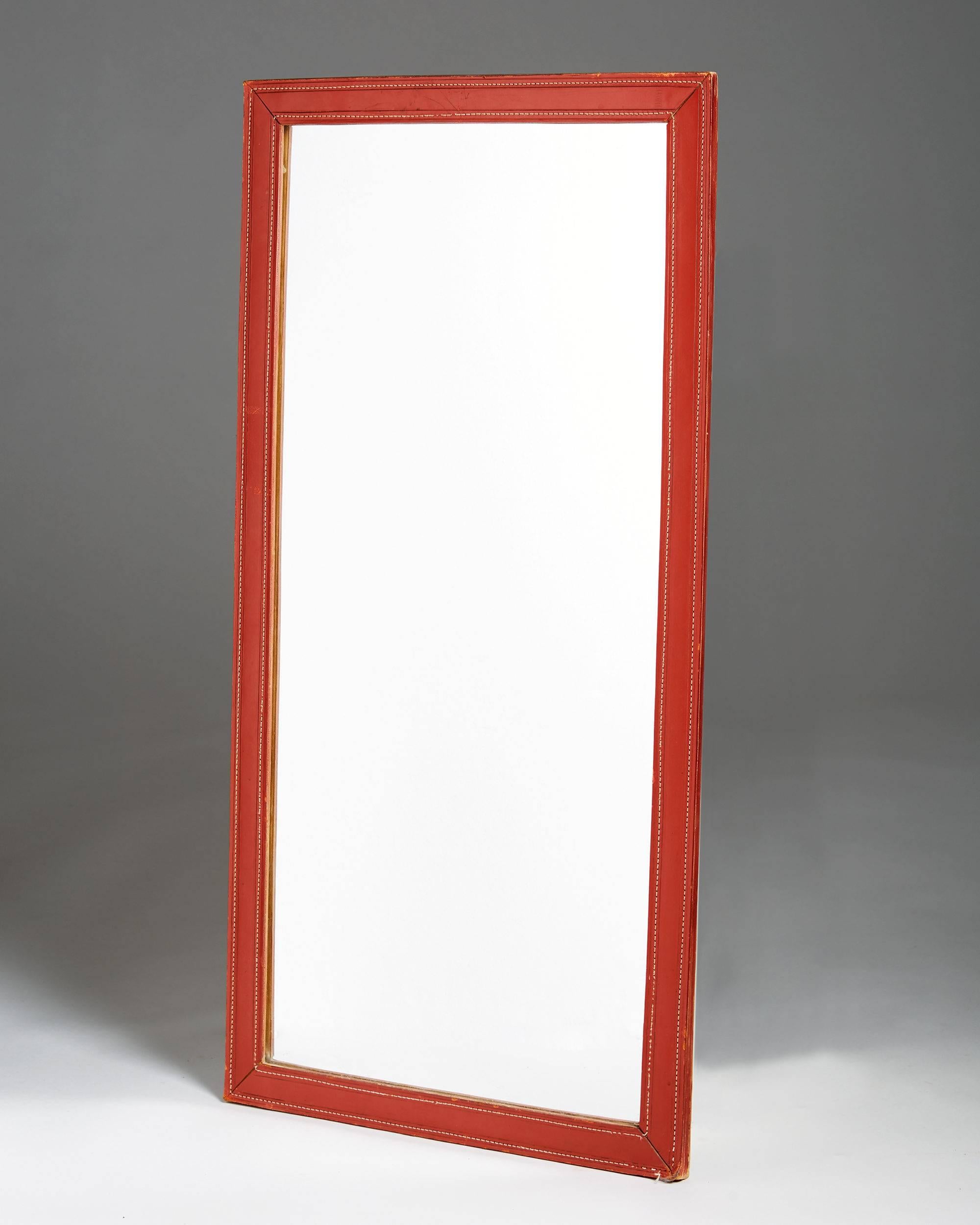Mirror anonymous,	
Sweden. 1960s.

Stitched leather frame.

H: 91 cm/ 3''
W: 46 cm/ 18''