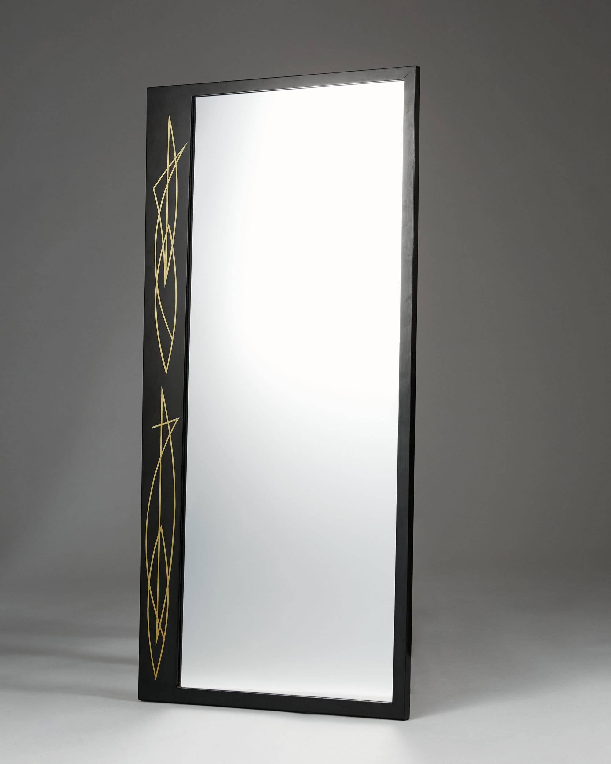 Mirror anonymous, 
Sweden, 1950s.

Lacquered wood with brass inlay.

Measurements:
H: 96 cm/ 37 3/4''
W: 48 cm/ 19''.