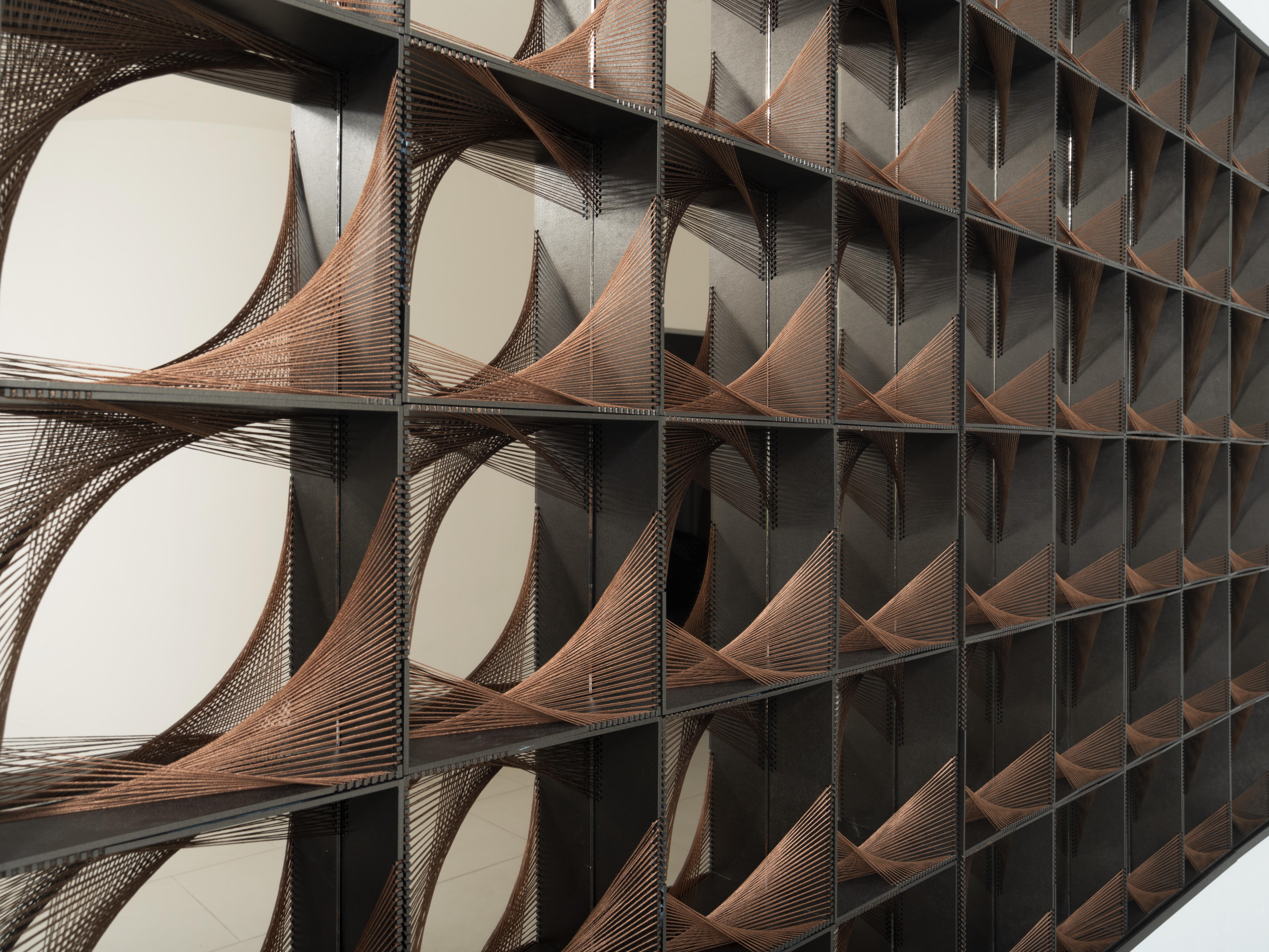 This wall decor piece is a stunning work of art, composed of 96 tridimensional elements that captivate attention from every angle. Each of the geometric pieces is expertly arranged to create a dynamic and visually striking composition, blending a