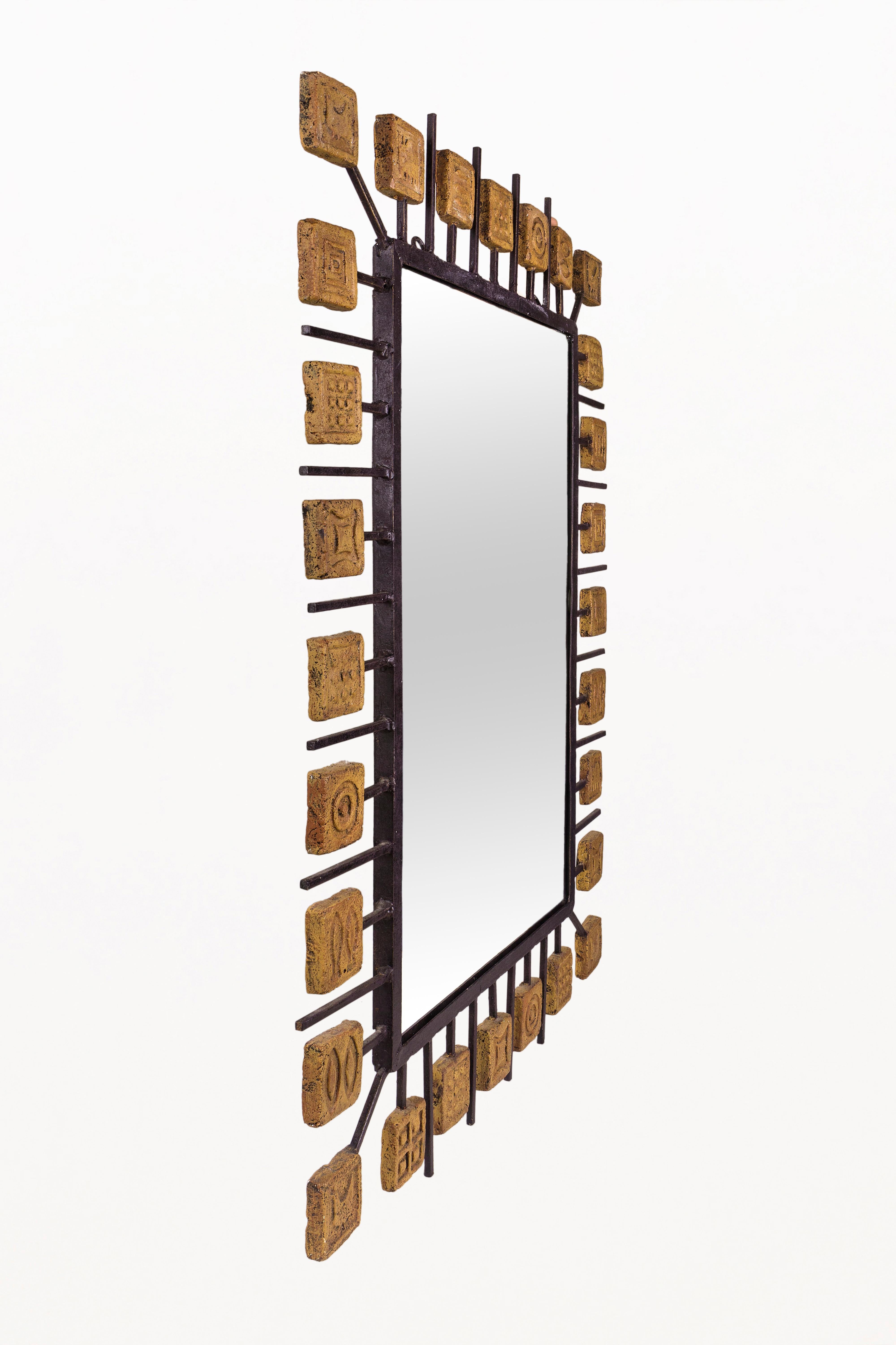 Mirror attributed to Clizia.
Lacquered metal and terracotta,
Italy, circa 1970
Very good vintage condition.
 