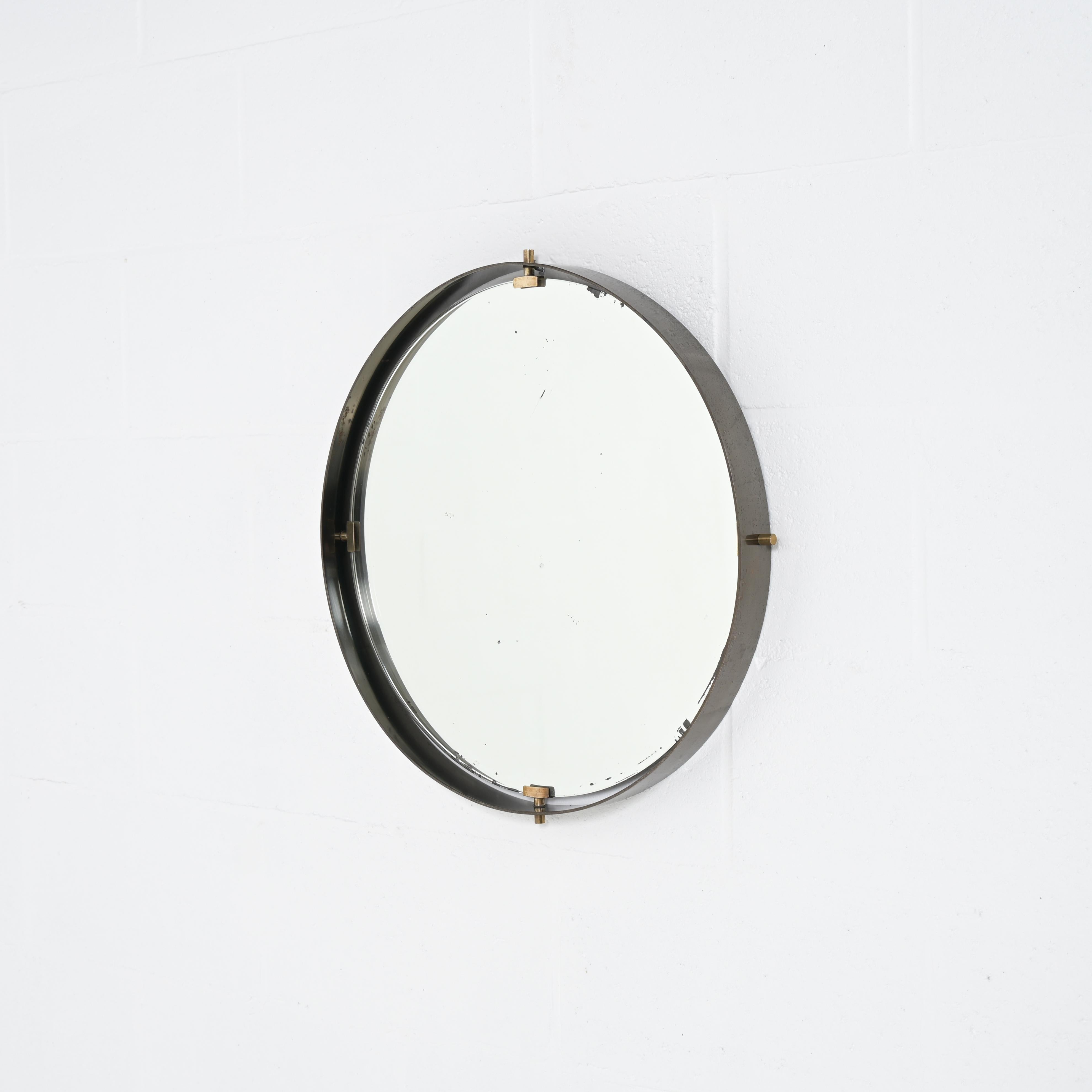 Because of its high-quality finish and design, I can attribute this mirror to Fontana Arte. The mirror is aged and have some small marks as you can see in the pictures.  The mirror is attached with 4 bronze brackets.

We can replace the mirror if