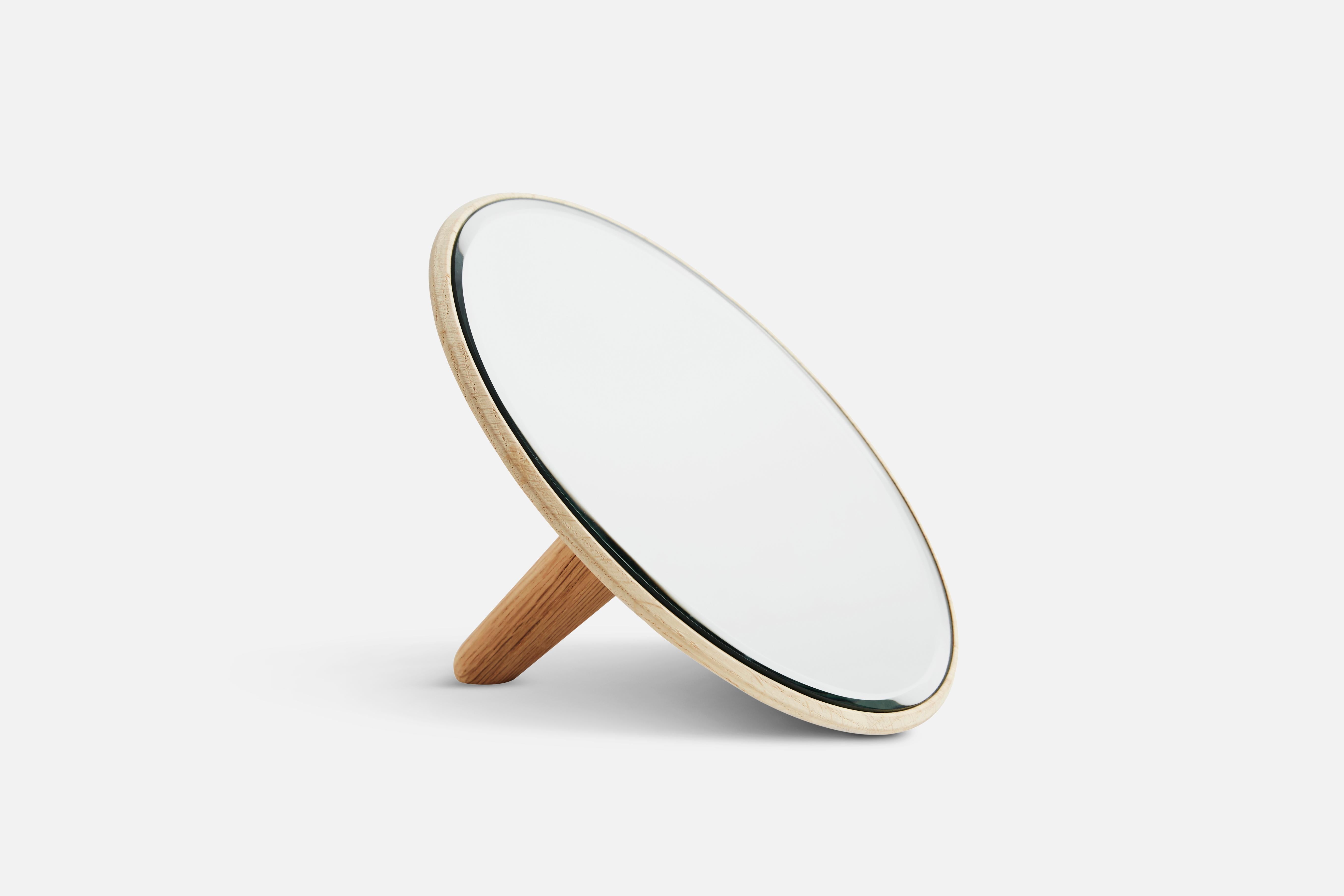 Mirror Barb by Martin Zanolin
Materials: oak.
Dimensions: D 11.5 x W 26 x H 26 cm

Mirror Barb is a circular mirror made from solid oak. Made for multiple purposes. The
mirror comes with both a bracket for the wall and a handle, which allows